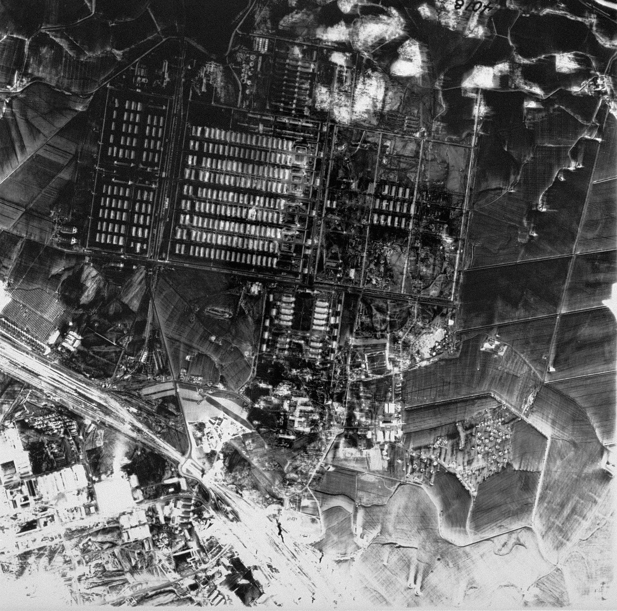 An aerial reconnaissance photograph showing Auschwitz II (Birkenau). [oversized photograph]