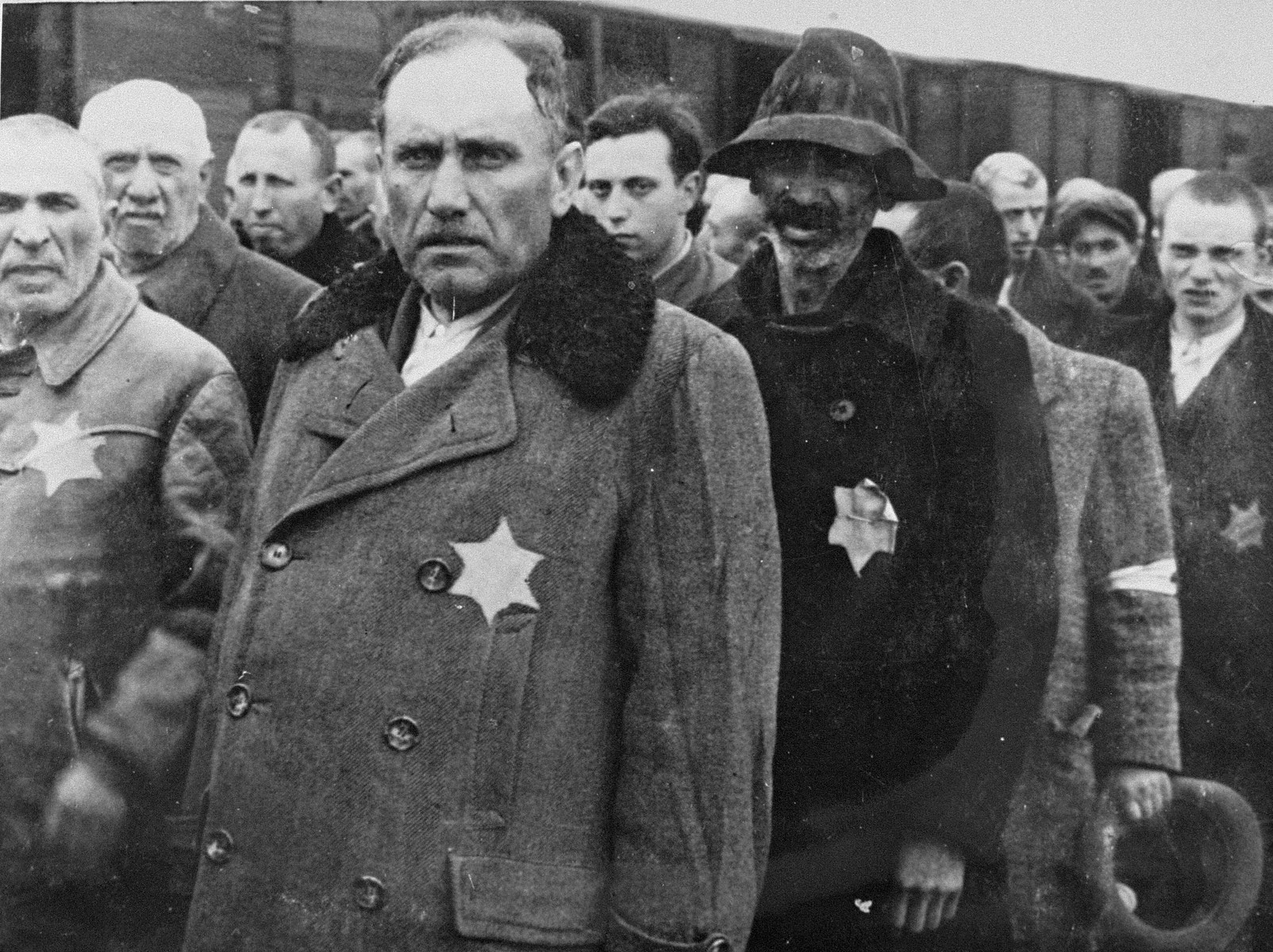 Jewish men from Subcarpathian Rus await selection on the ramp at Auschwitz-Birkenau.