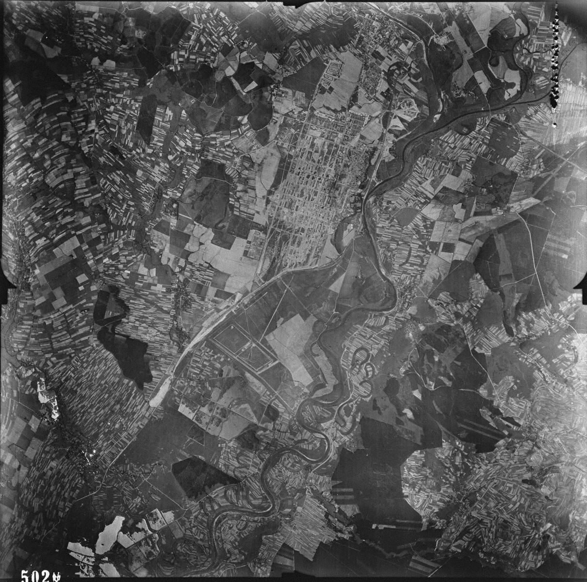 An aerial reconnaissance photograph showing Auschwitz III (Monowitz) and the IG Farben "Buna" plant. [oversized photograph]

Mission:  60 PRS/462 60 SQ;  Scale: 1/54,000;  Focal Length: 6";  Altitude: 27,000'
