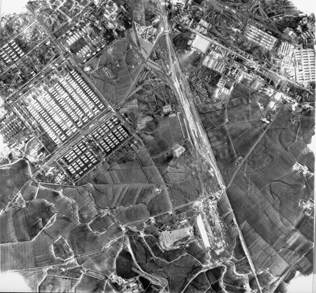 An aerial reconnaissance photograph showing Auschwitz II (Birkenau). [oversized photograph]