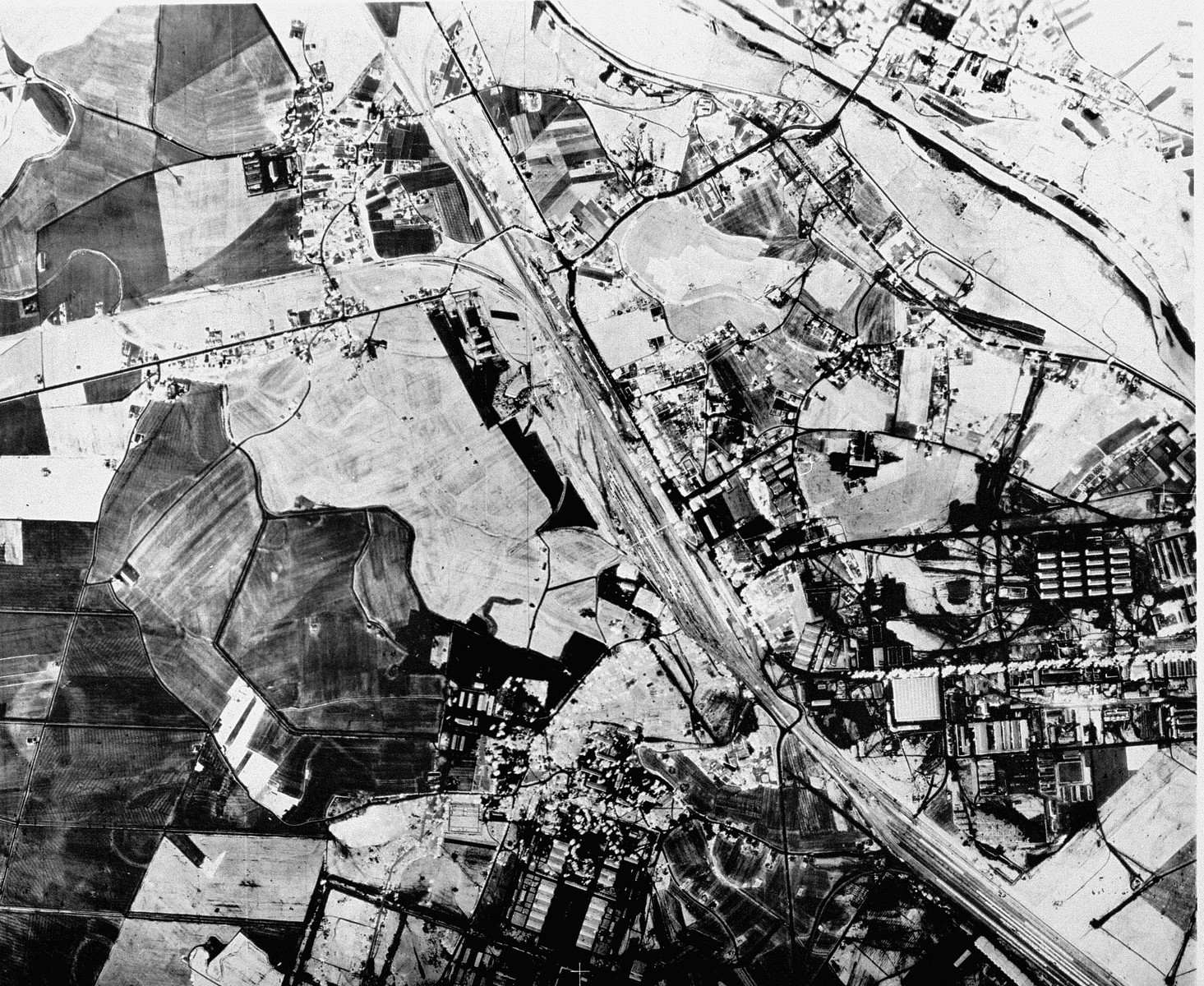 An aerial reconnaissance photograph of  Auschwitz I showing the administrative area as well as the railway lines to the camp.