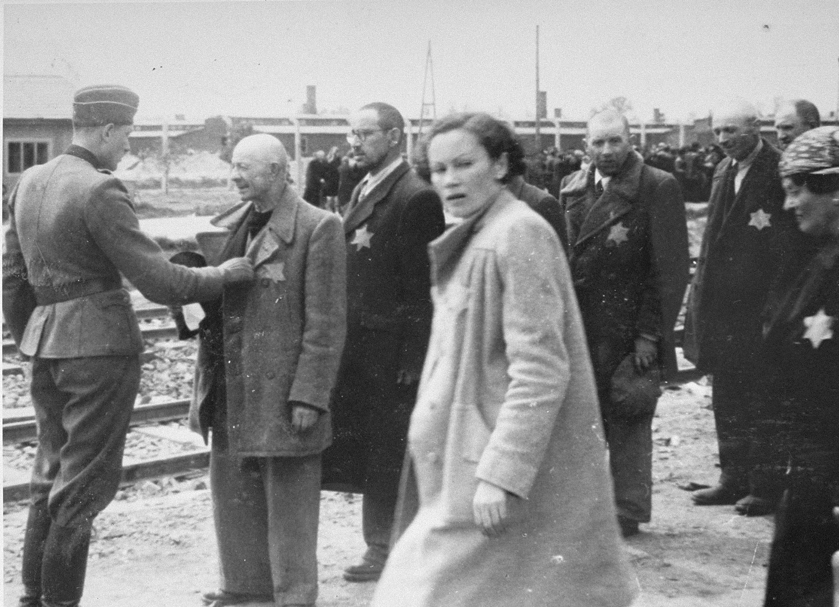 Jews from Subcarpathian Rus undergo a selection on the ramp at Auschwitz-Birkenau.

In front of him is Geza Lajtbs of Budapest.