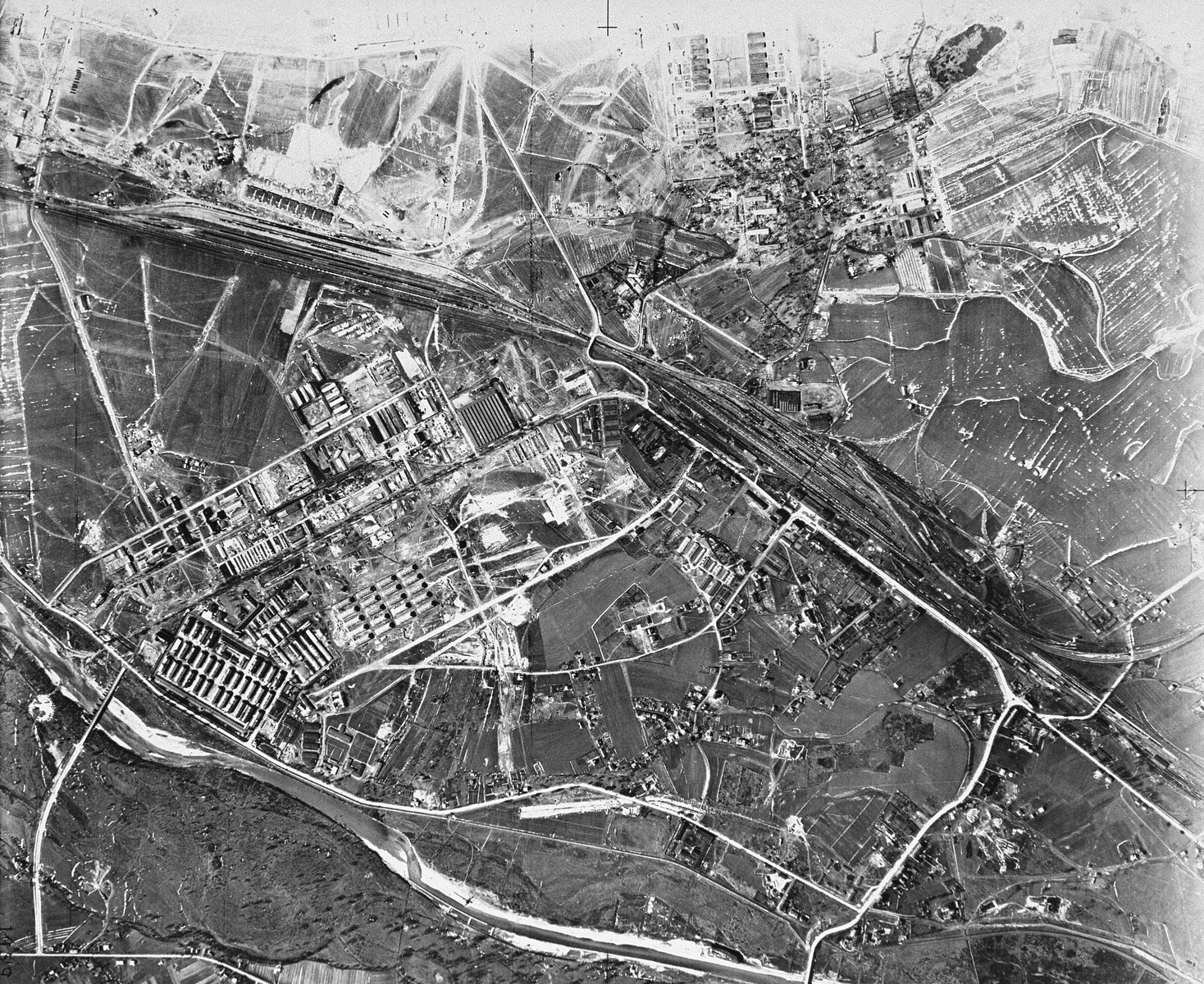An aerial reconnaissance photograph of the Auschwitz area showing the Auschwitz I camp. [Oversized photo]

Mission:  60 PR 288 60 SQ;  Scale: 1/15,569;  Focal Length: 20";  Altitude: 26,000'