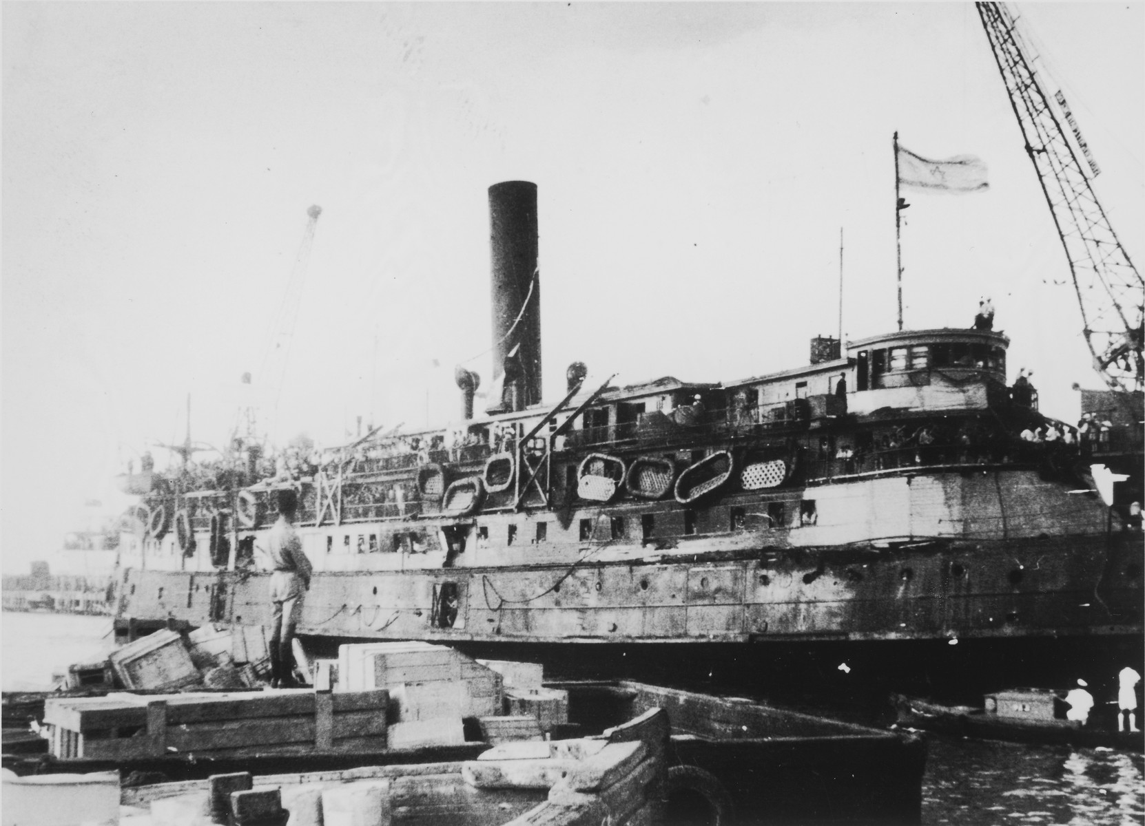 The battered illegal immigrant ship, Exodus 1947, docks in Haifa harbor.