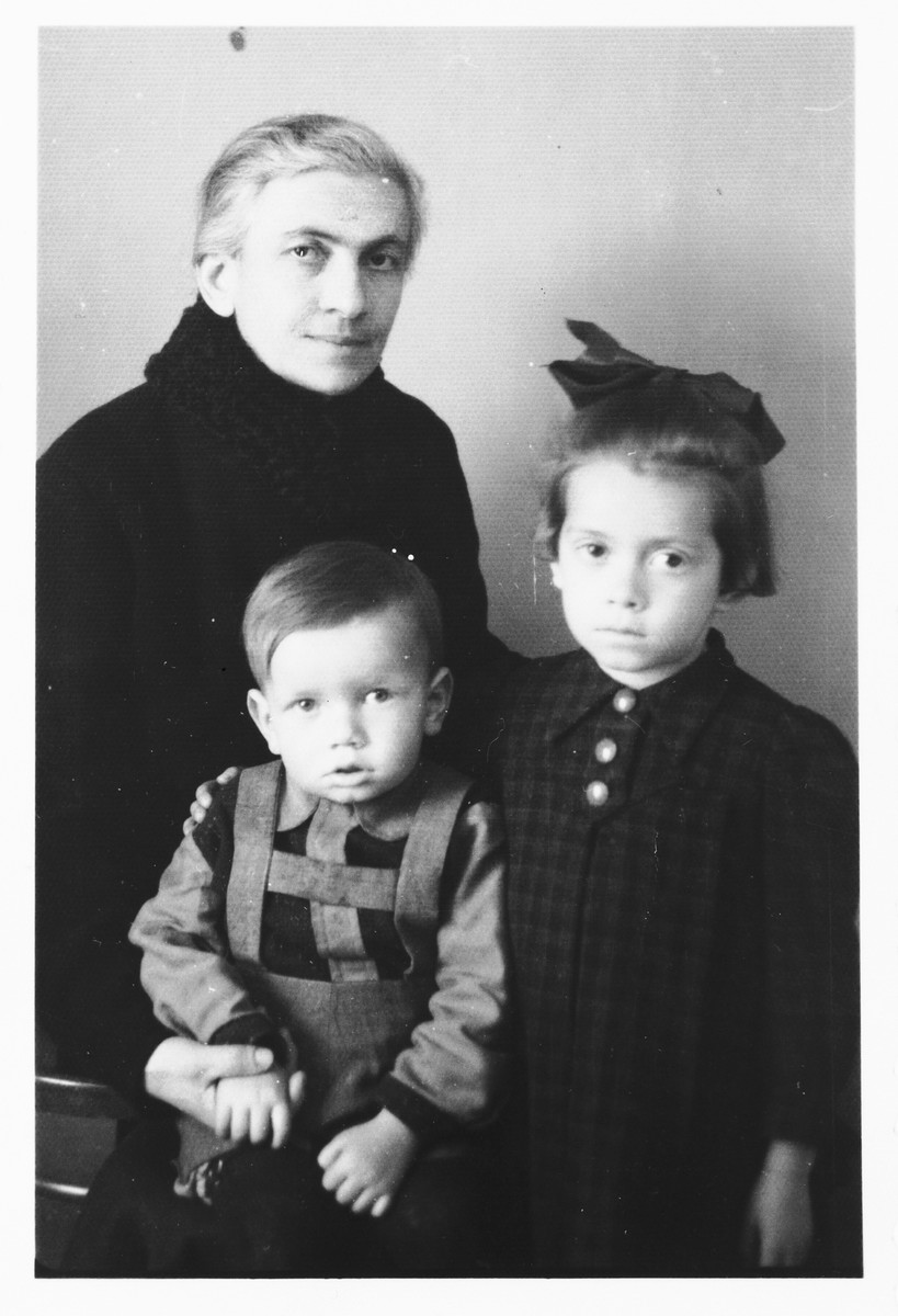 Studio portrait of a Jewish woman with her neice and nephew that she sent to her non-Jewish husband imprisoned in the Jasenovac concentration camp.

Pictured are Giza (Deutsch) Vrancic with Teodora and Zdravko Basch.