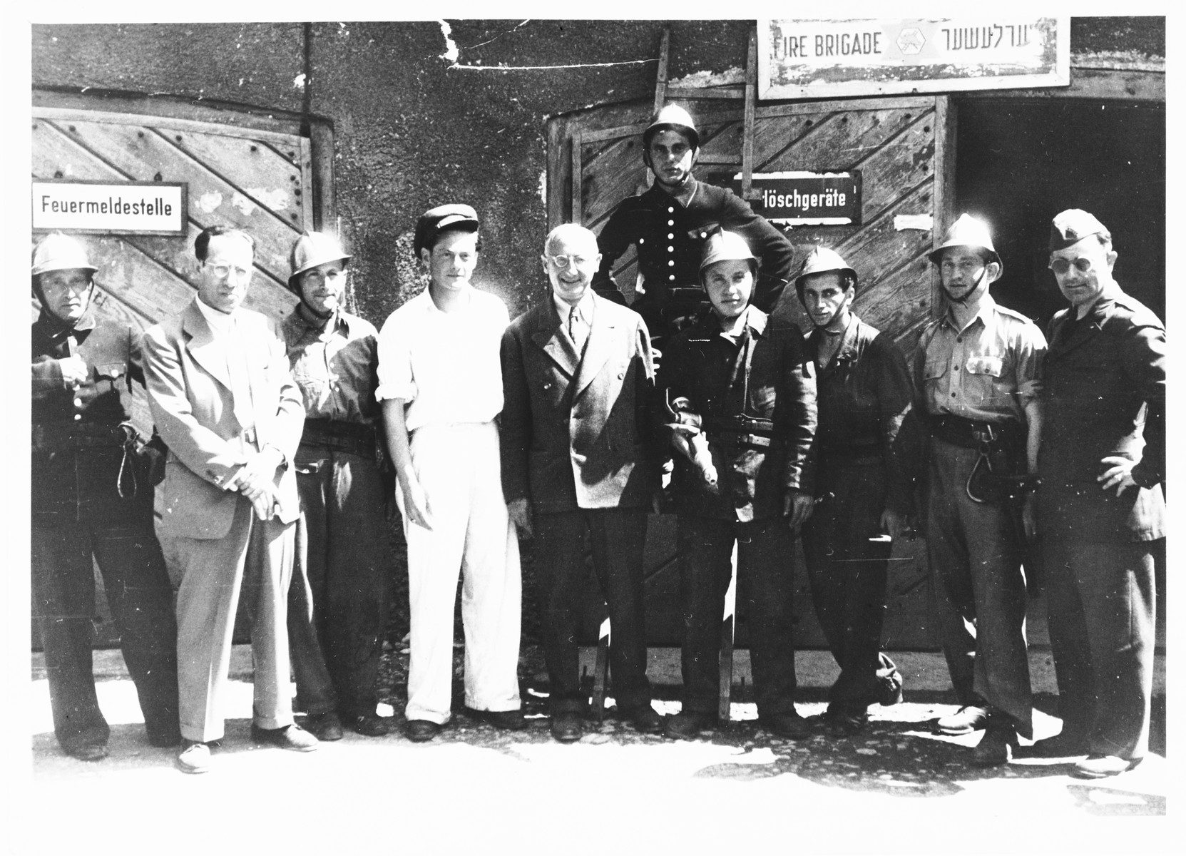 Issak Libstug visits the Foehrenwald fire department.

Also pictured is Sol Zeifman (second from the right).