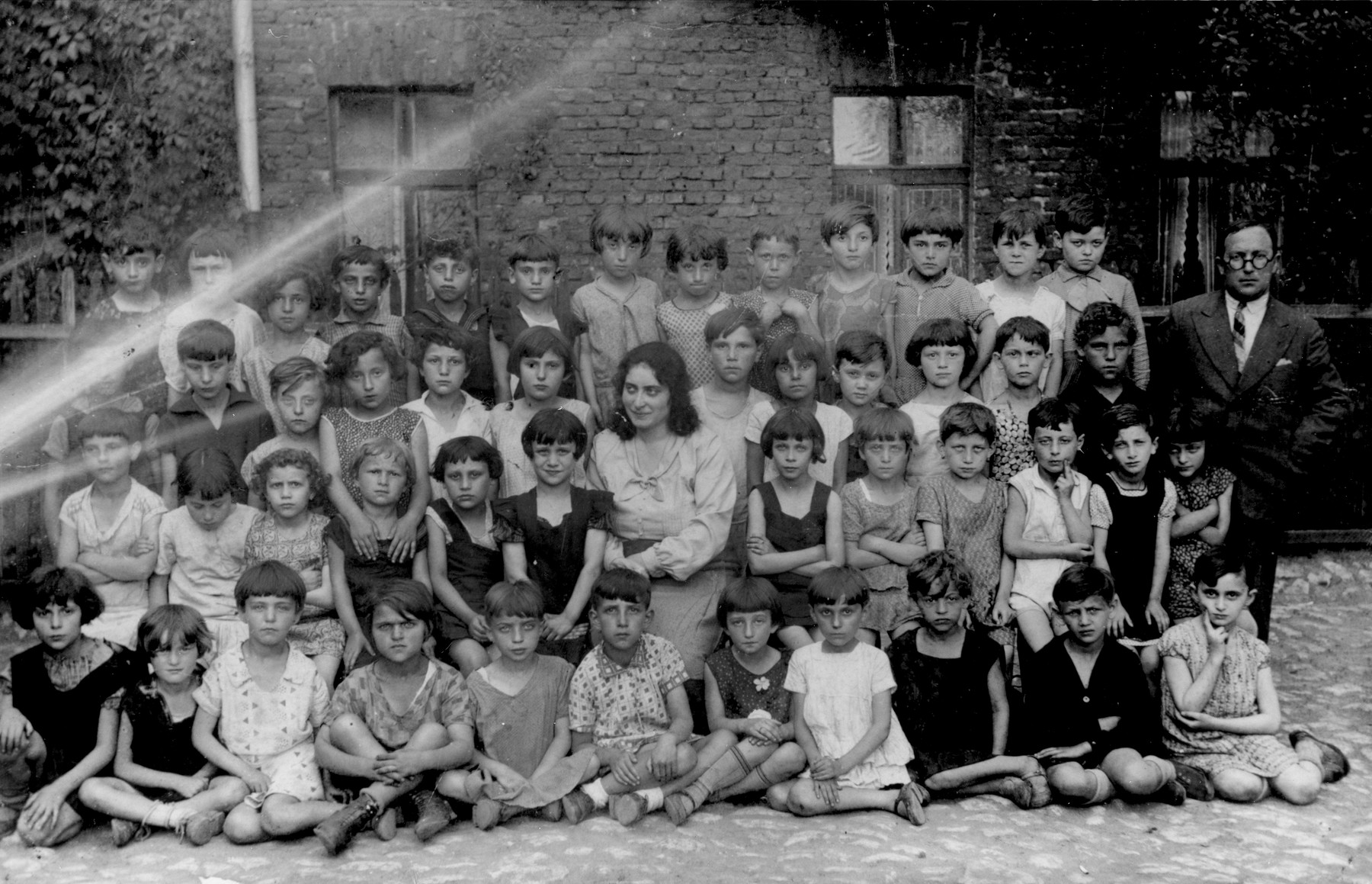 Group portrait of students and their teachers at a Jewish elementary school in Bedzin.