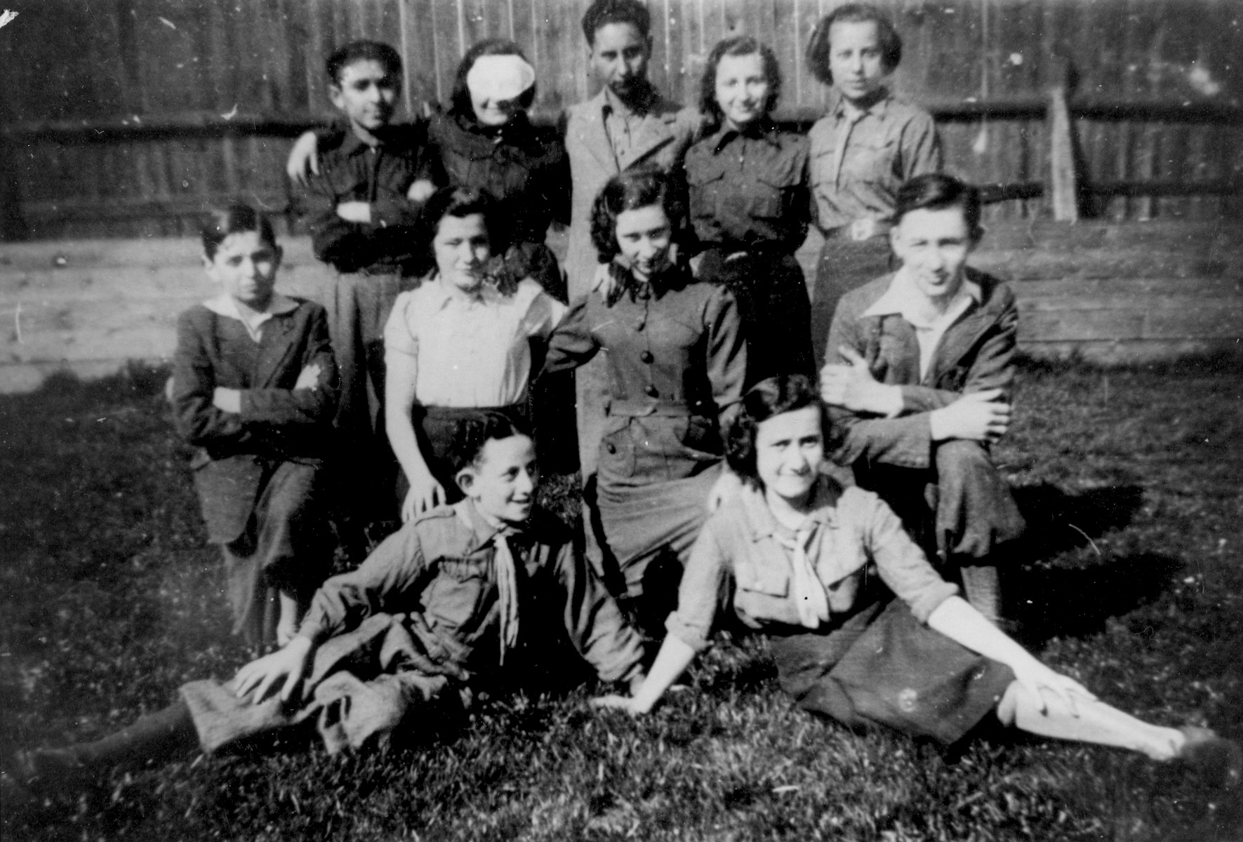 Group portrait of members of the Hanoar Hatzioni Zionist youth movement in Bedzin.

Among those pictured are: Abramek Szyjewicz (front row, left), Tova Faska (front row, right), and Rozia Londner (second row, second from the right).