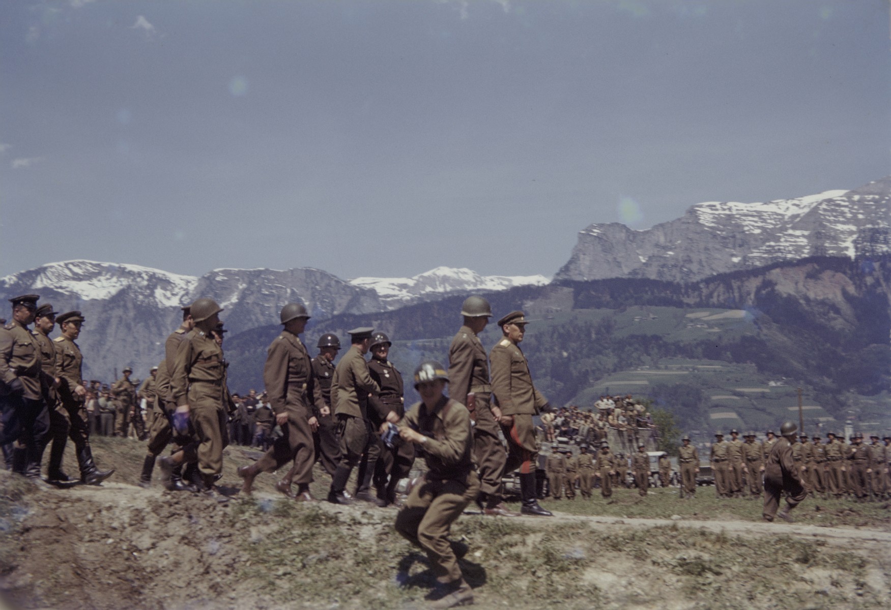 Members of the U.S. 9th Armored Division meet up with units of the Red Army near Linz, Austria.