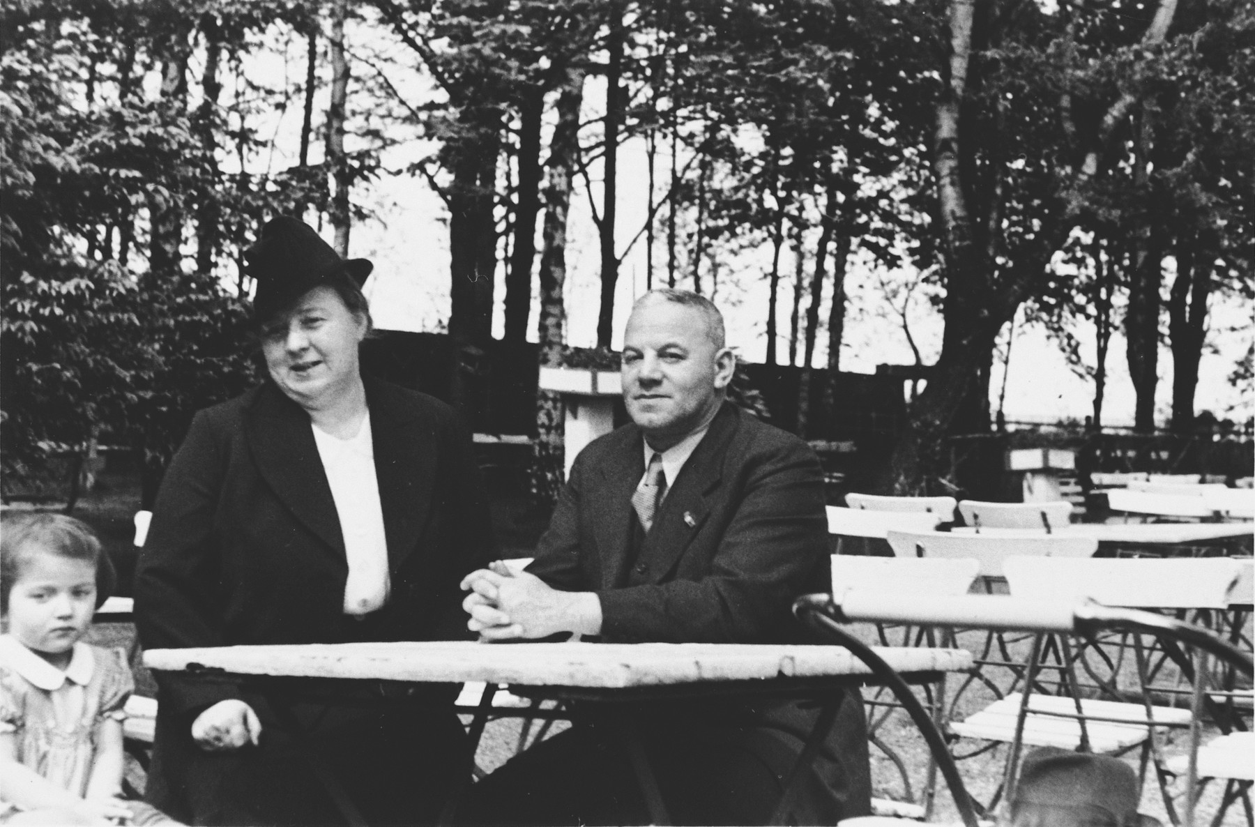 An intermarried German-Jewish couple sits at a table in a park in Stettin, Germany.

Pictured are Erich and Trude Berndt.  Erich, who was the brother of Lotte Berndt, was deported to Theresienstadt near the end of the war, but survived.