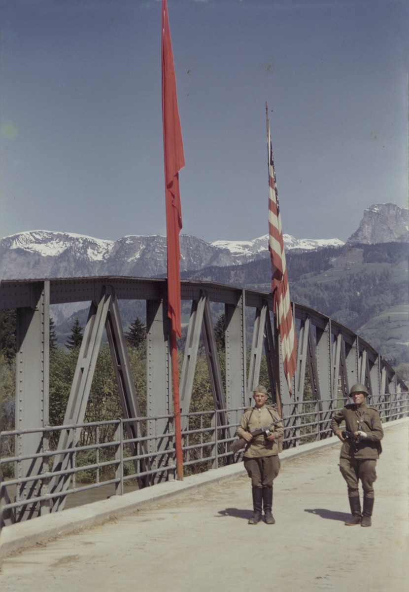 Members of the U.S. 9th Armored Division meet up with units of the Red Army near Linz, Austria.

Pictured is the Roethelbruecke Bridge over the Enns River, between Liezen and Selzthal.