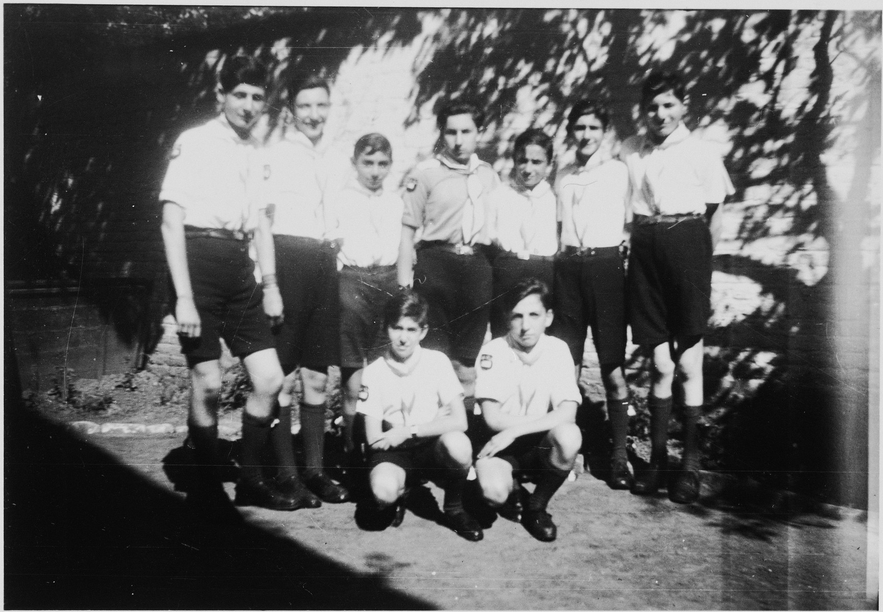 Group portrait of members of the Tel Chai Zionist youth group at the Orphelinat Israelite de Bruxelles children's home of the rue des Patriotes.

Among those pictured are: Joseph Gerber, Charles Amsel, Gabi Lehrer, Albert Tennenbaum, Joseph Adler, David Finkelstein, and Manfred Somer.