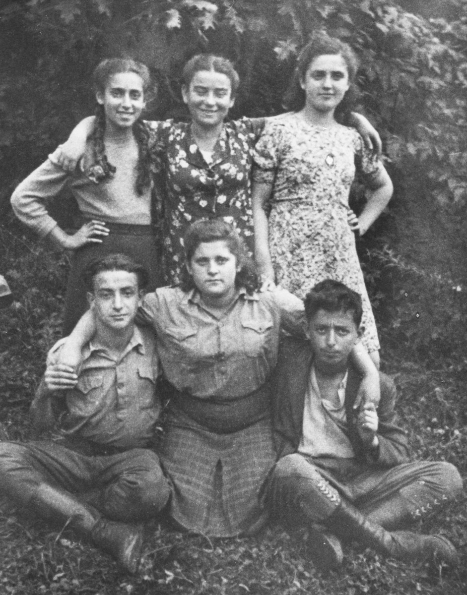Group portrait of five adolescents in the Selvino children's home.