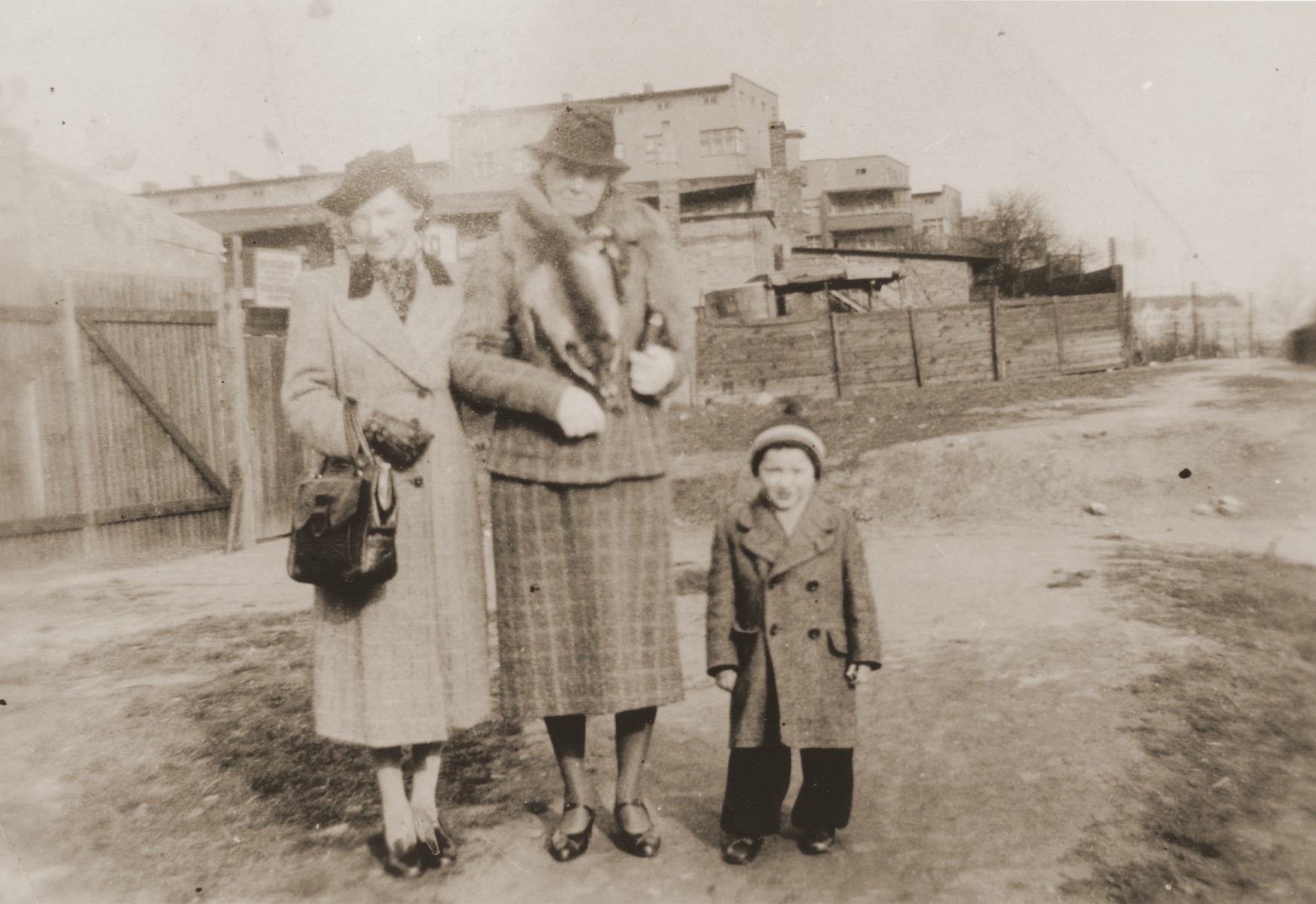 Mathilde Stern stands on an unpaved road in Willebadessen with her daughter-in-law, Resi Markhoff Stern, and grandson, Manfred.