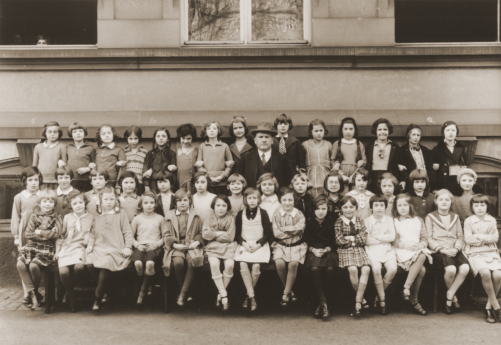Group portrait of students at the Holzhausen Schule, an elementary school in Frankfurt.  

Lore Gotthelf is pictured in the back row, third from the right.
