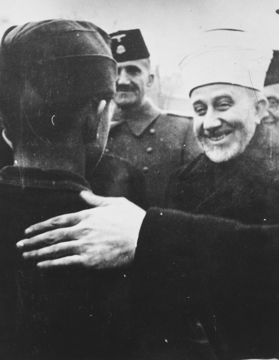 Hajj Amin al-Husayni greets a Bosnian member of the Waffen-SS during his visit to Bosnia.