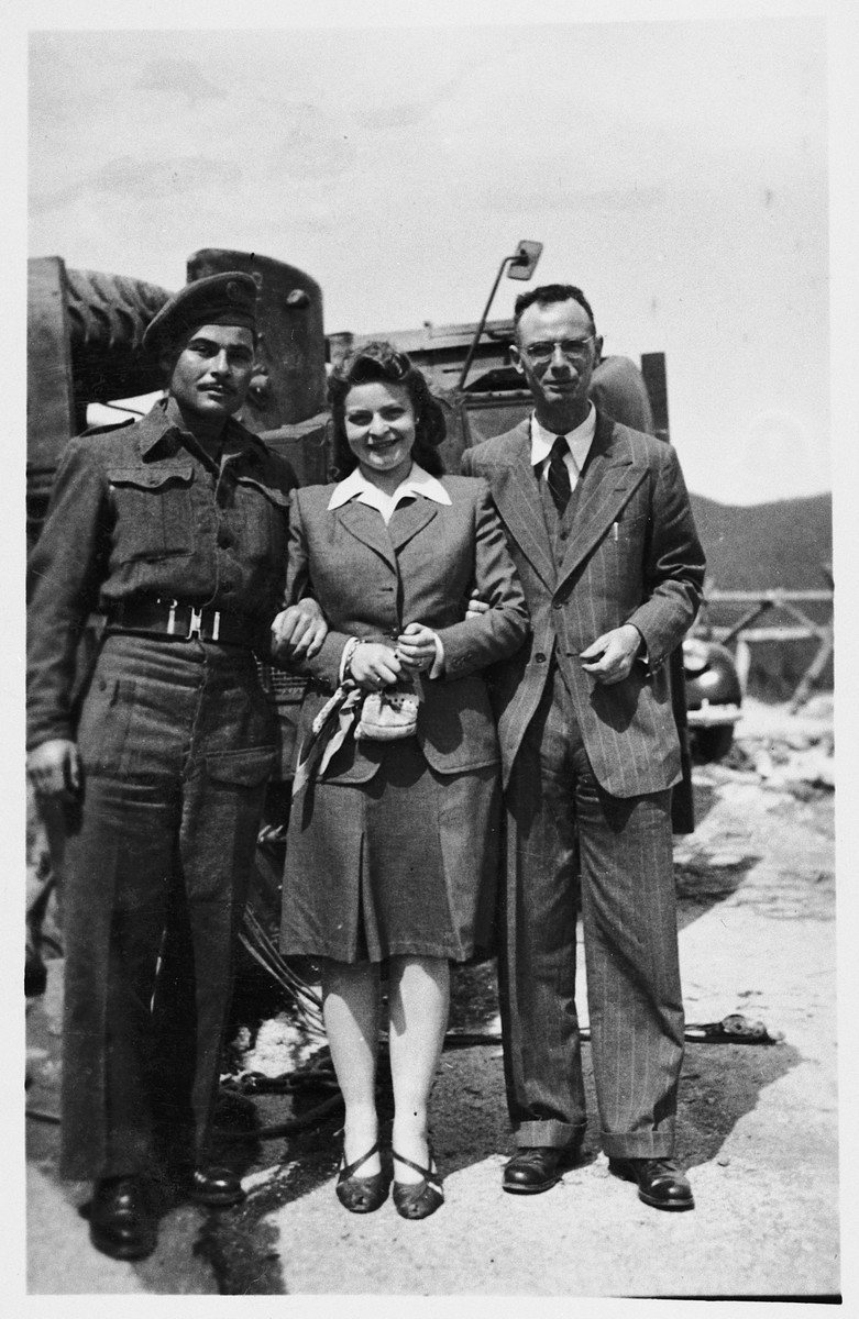 Roma and Immanuel Ascarelli pose next to a military vehicle along with another friend from the Jewish Brigade.