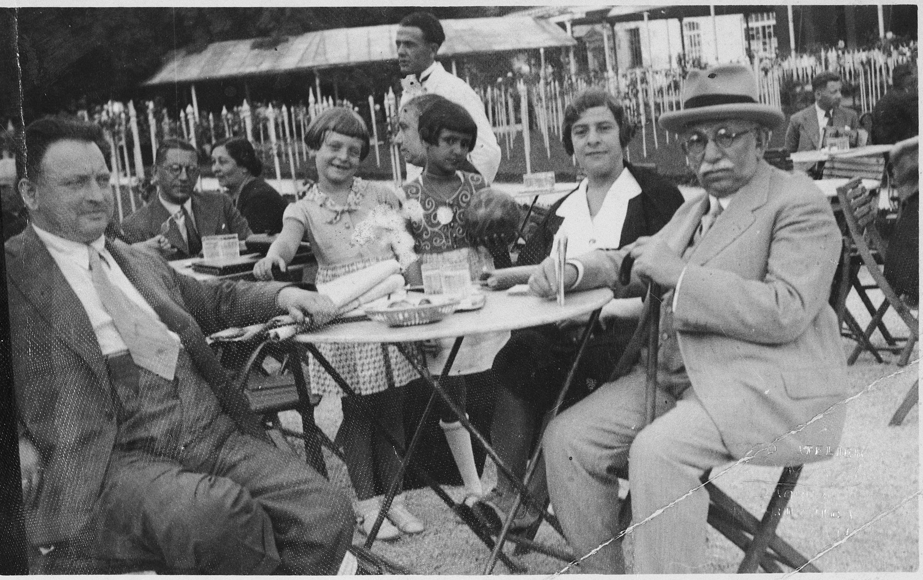 The Wessel family enjoys a visit to an outdoor cafe.

Pictured from left to right are Samuel Wessel, his daughter Roma, a friend, his wife Rosa and another friend or relative.