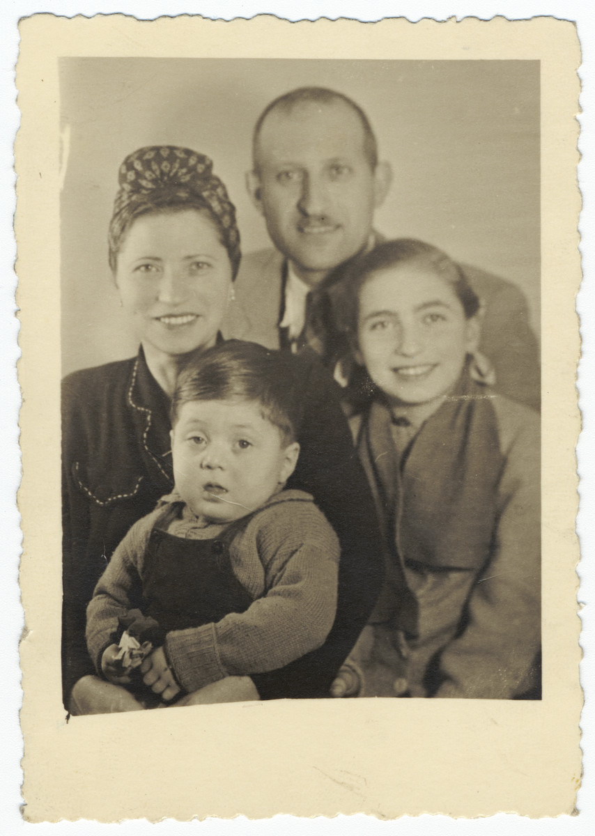 Postwar portrait of a Jewish family in Budapest.

Pictured are Olga, Eliezer, Eva and Yakov Freedman.