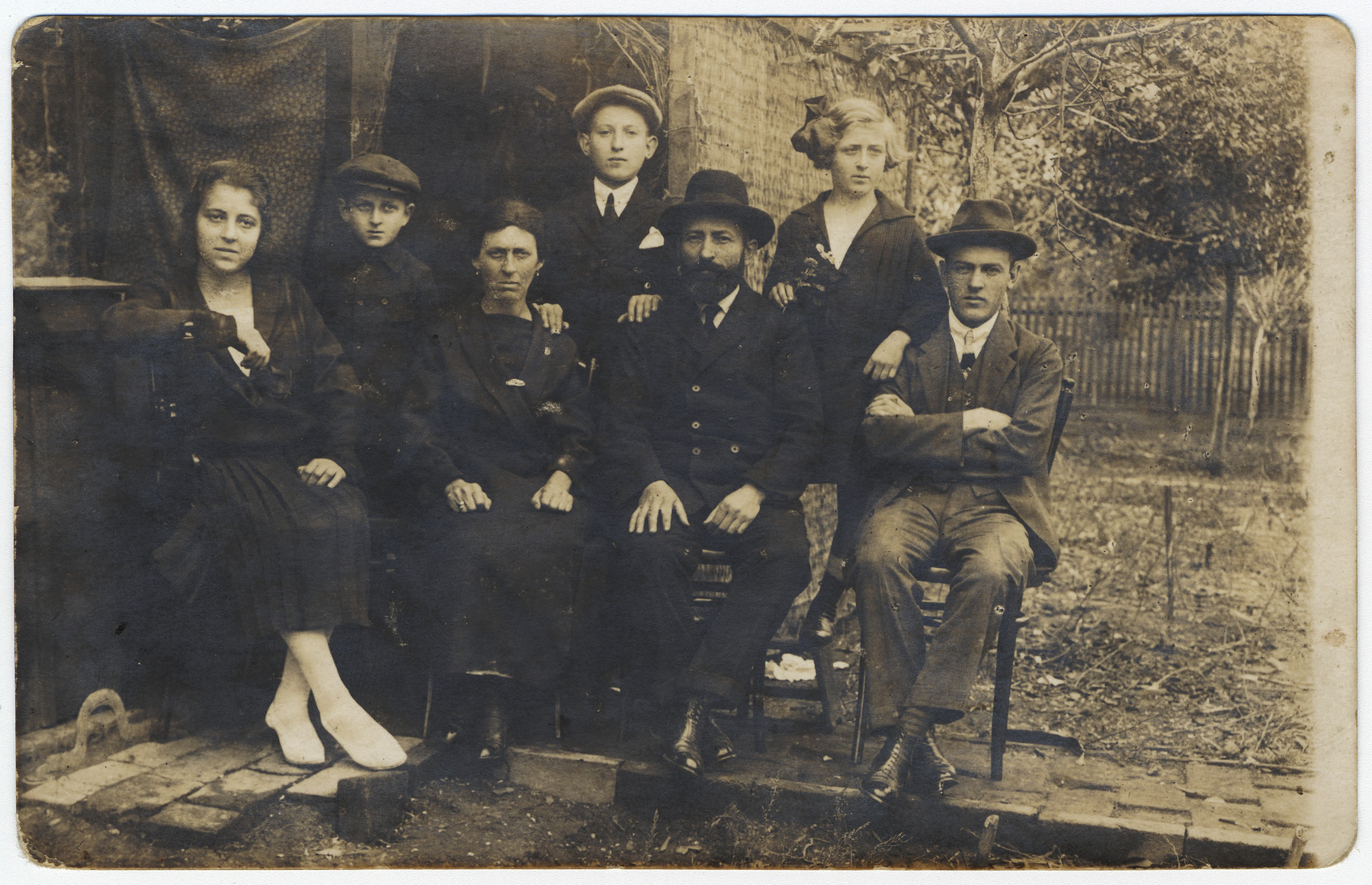 Prewar portrait of the Freedman family.

From left to right are a married sister, Yitzchak, the mother Hennia, Albert, the father Yona, a sister and the older sister's husbnd.  Of the Freedman family only Yitzchak, Albert and Yona survived.