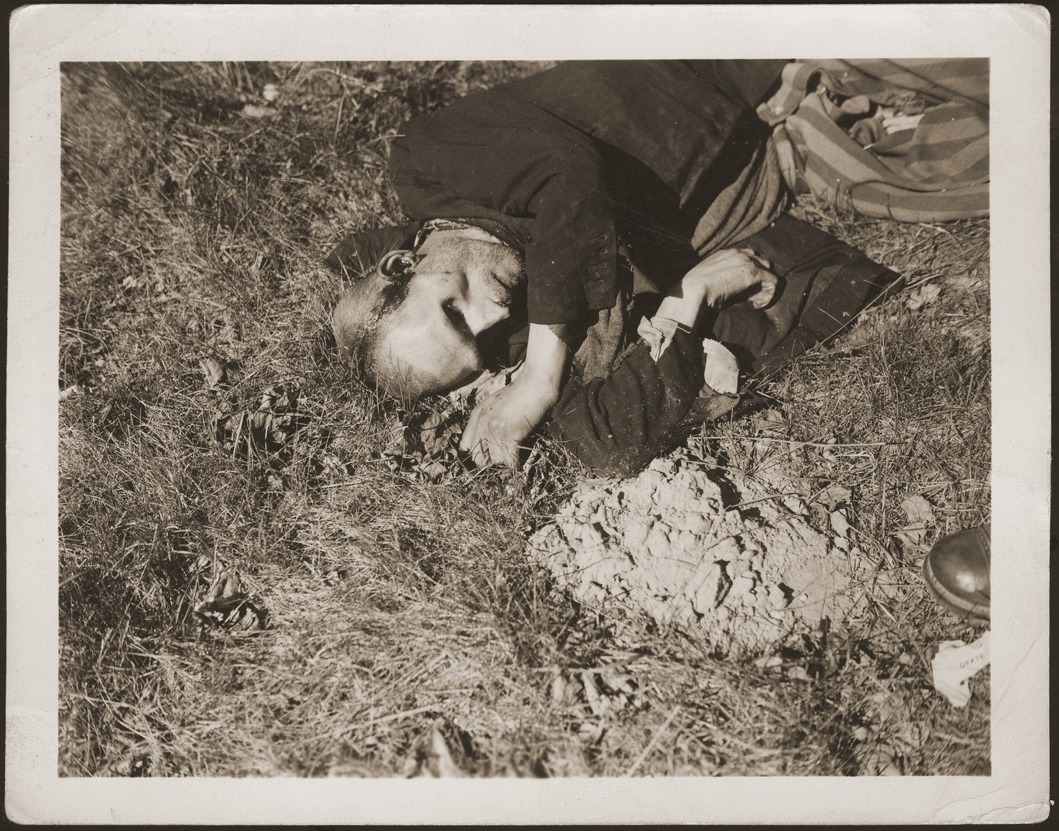 The body of a prisoner shot on the road near Gardelegen.  The prisoner was shot by the SS when he was too exhausted to continue on a death march from the nearby town of Mieste.