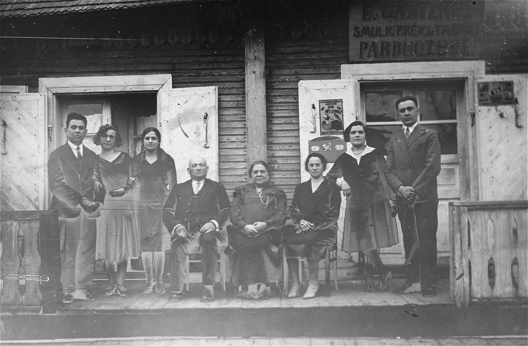 Group portrait of the Gar family in front of the grandmother's home in Kron, Lithuania.

Pictured from left to right are: Joseph Gar, unknown, unknown;  David Gar; Esther Gar; unknown, Chaya Gar; Jacob Gar.