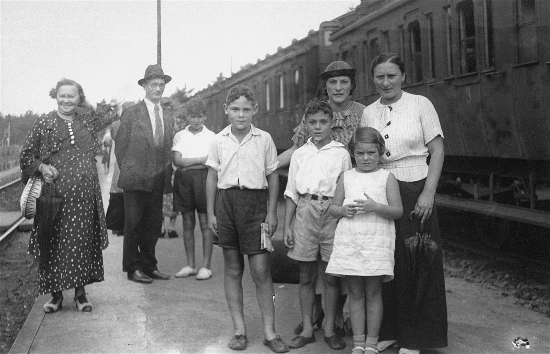 A Jewish family poses at a train station in Riga.

Among those pictured are Debora Nurock and Chassia Rosenthal.