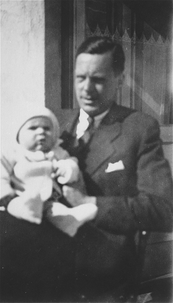 Honorary Dutch Consul Jan Zwartendijk with his son Robert in Kovno.

Jan Zwartendijk (1896-1976) arrived in Kovno in 1938 as the Dutch representative of Philips Electric in Lithuania.  Soon after the fall of Holland to Hitler's forces on 10 May 1940, however, Zwartendijk was named the honorary Dutch consul by ambassador LPJ de Decker in Riga, Latvia, who sacked the official consul for having pro-Nazi sentiments.  This change came at roughly the same time as the Soviet occupation of Lithuania in June 1940.  Zwartendijk was then approached in the third week of July 1940 by Nathan Gutwirth, a Dutch national and young yeshiva student in Tels, Lithuania, who he had come to know through their common interest in soccer. Gutwirth requested a transit visa to Curacao, which Zwartendijk was denied permission to give.  Zwartendijk then appealed to de Decker for help and the ambassador sent him a document stating that no visa was necessary for travel to Curacao, and that landing was permitted solely at the discretion of the island's governor.  De Decker suggested that Zwartendijk simply strike out the part about the governor's authority and write into Gutwirth's passport an official statement that he was travelling to Curacao.  Zwartendijk followed this course and within hours Gutwirth had spread word about the 'pseudo visas' among the thousands of Polish-Jewish refugees in Kovno, who subsequently flooded Zwartendijk's office seeking 'Curacao visas'.  These 'visas' were then used by refugees to procure Japanese transit visas from Sugihara through the USSR.  It is estimated that by the time the Dutch consulate was closed at the beginning of August 1940, Zwartendijk had written between 1200 and 1400 life saving 'visas'.