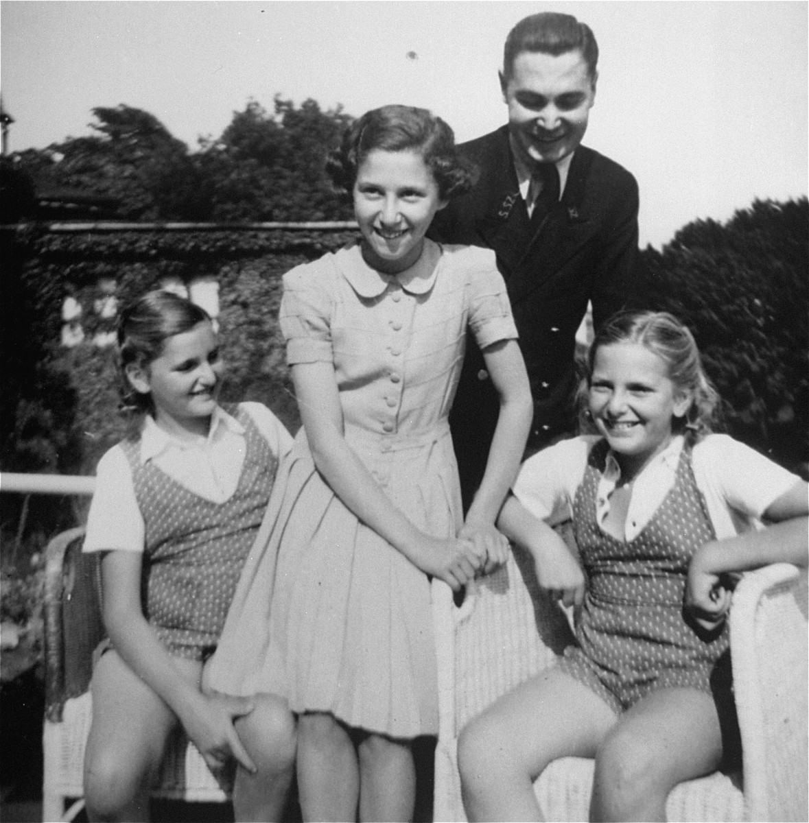 Dorottya (Dolly) Dezsoefi, far left, and her twin sister, Ida Marianne (Mari), with Mr. Zimmermann and his daughter at a resort hotel.  

The Zimmermanns did not survive the war.