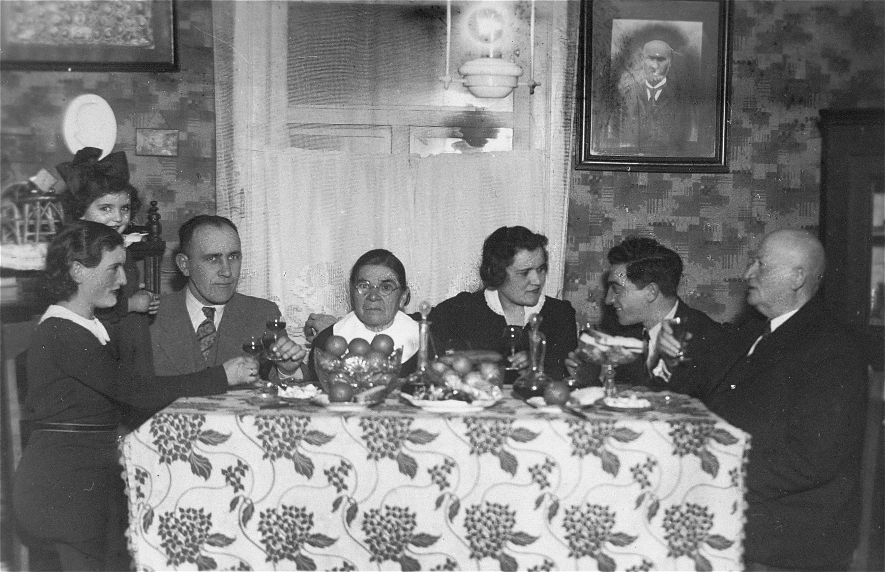 The engaged couple, Eliezer and Chaya Gar, eat at the Gar home in Kron.

Pictured from left to right are: Baila, Chaviva, Jacob, Esther, and Chaya Gar; Eliezer Kaplan, and David Tkatch, a cousin of the Gars.