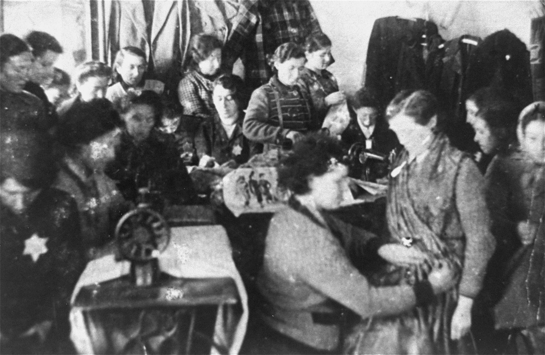 Jewish women working in a sewing workshop in the Glubokoye ghetto.  

Among those pictured is Chana Tzarlevitz.