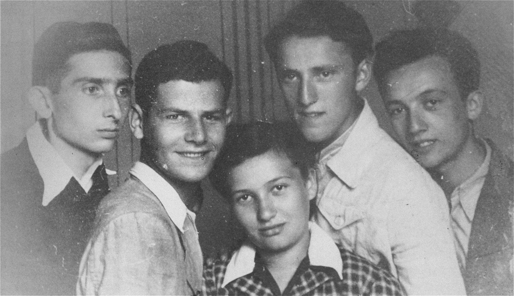 A group of Jewish youth in the Borislaw ghetto.

Pictured from left to right are: Rolek  (Raoul) Harmelin, Ducek Egit, Imek Eisenstein, Sabina Haberman and Jurek Haberman.  

Jurek  was shot by the Germans in the Borislaw labor camp on July 19, 1944, just three weeks before the arrival of the Red Army.   Rolek Harmelin survived the war and emigrated to Australia.