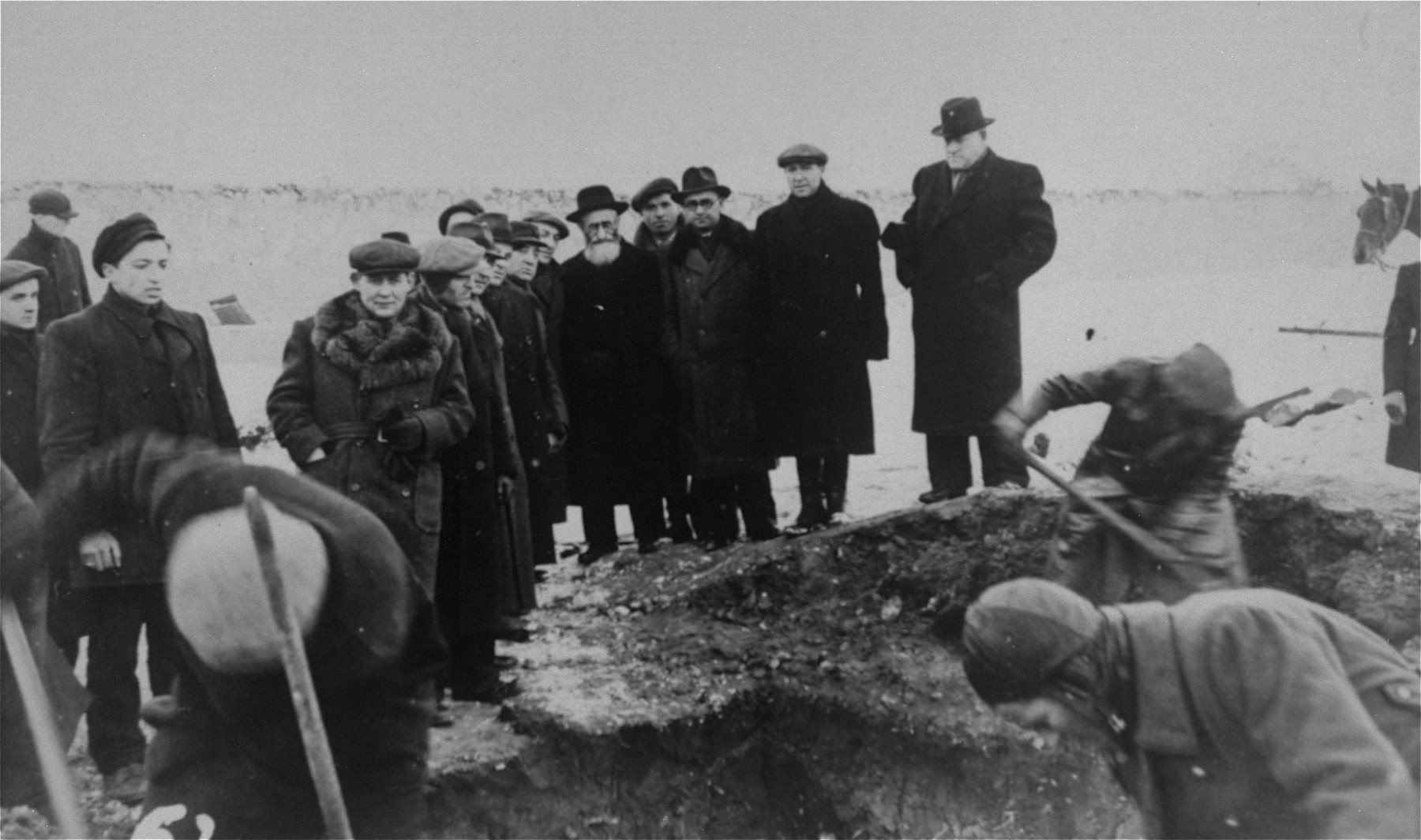 Jewish survivors exhume a mass grave containing the remains of Jews murdered by the Germans in Czestochowa during World War II.