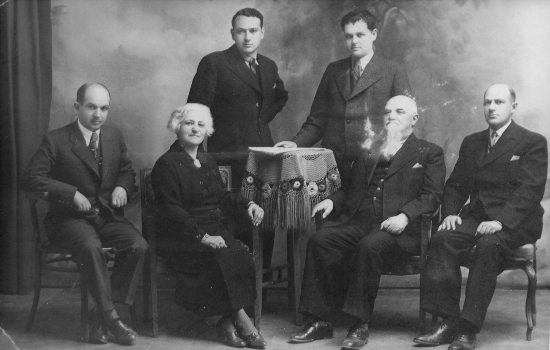 Portrait of the Preiss family in Kotoriba, Yugoslavia.
Pictured are Samu and Helen Rosenfeld Preiss and their four grown sons: Pista, Jani, Laci, and Bubi.  Samu and Helen were the donor's uncle and aunt.