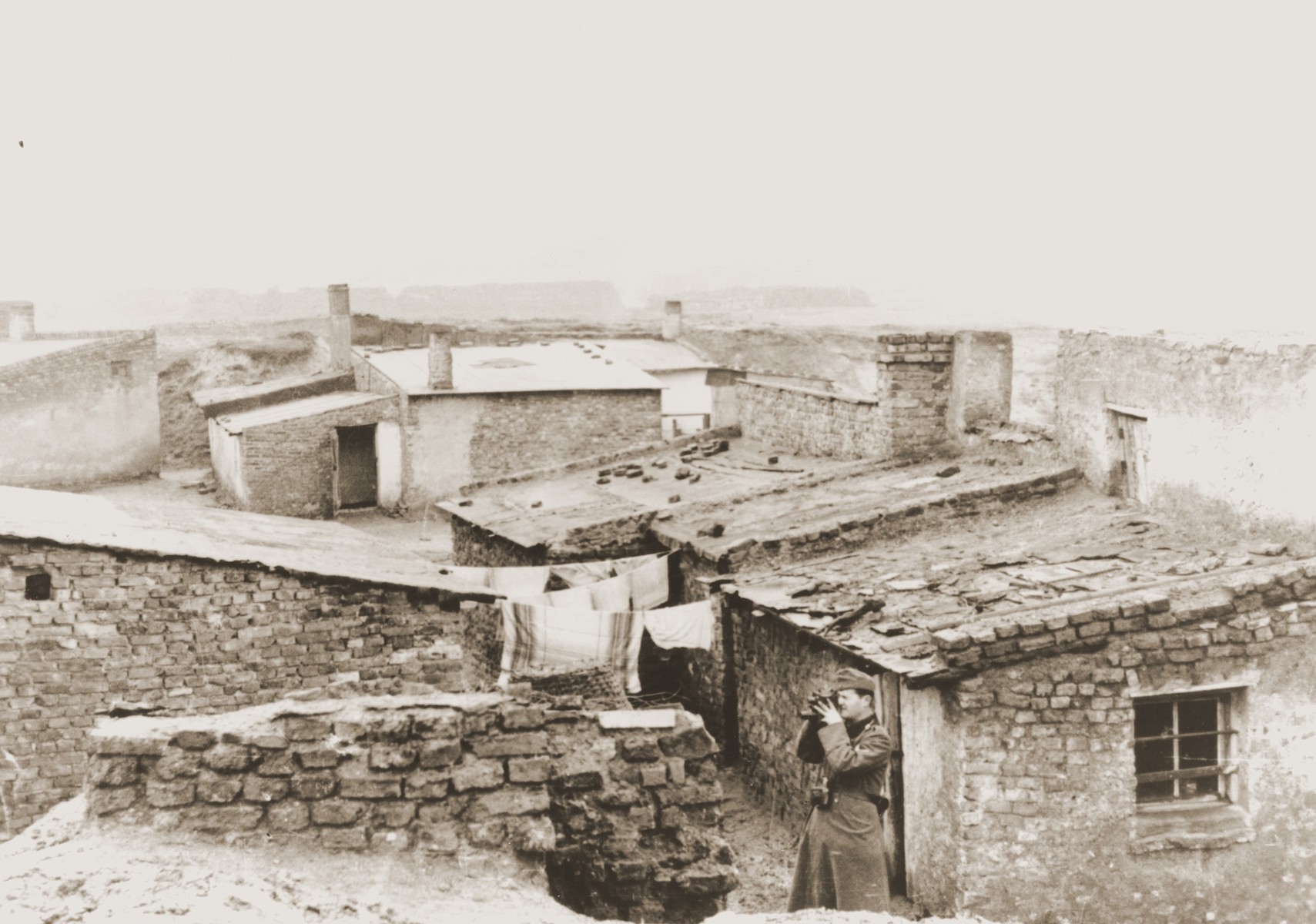 A German army photographer takes pictures in the Bedzin ghetto.