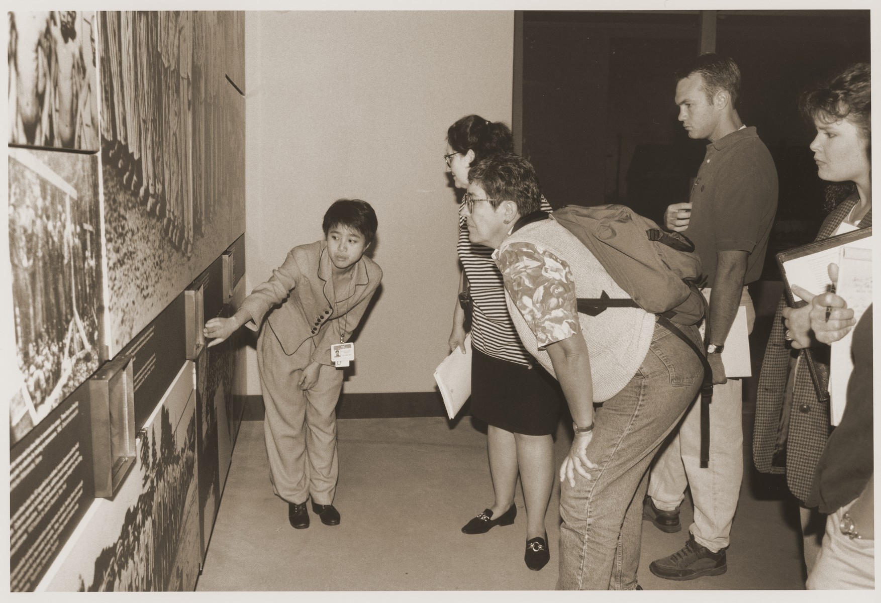 Mary Lou Abrigo guides a group of teachers participating in the Schusterman Teachers' Conference through the third floor of the permanent exhibit at the U.S. Holocaust Museum.