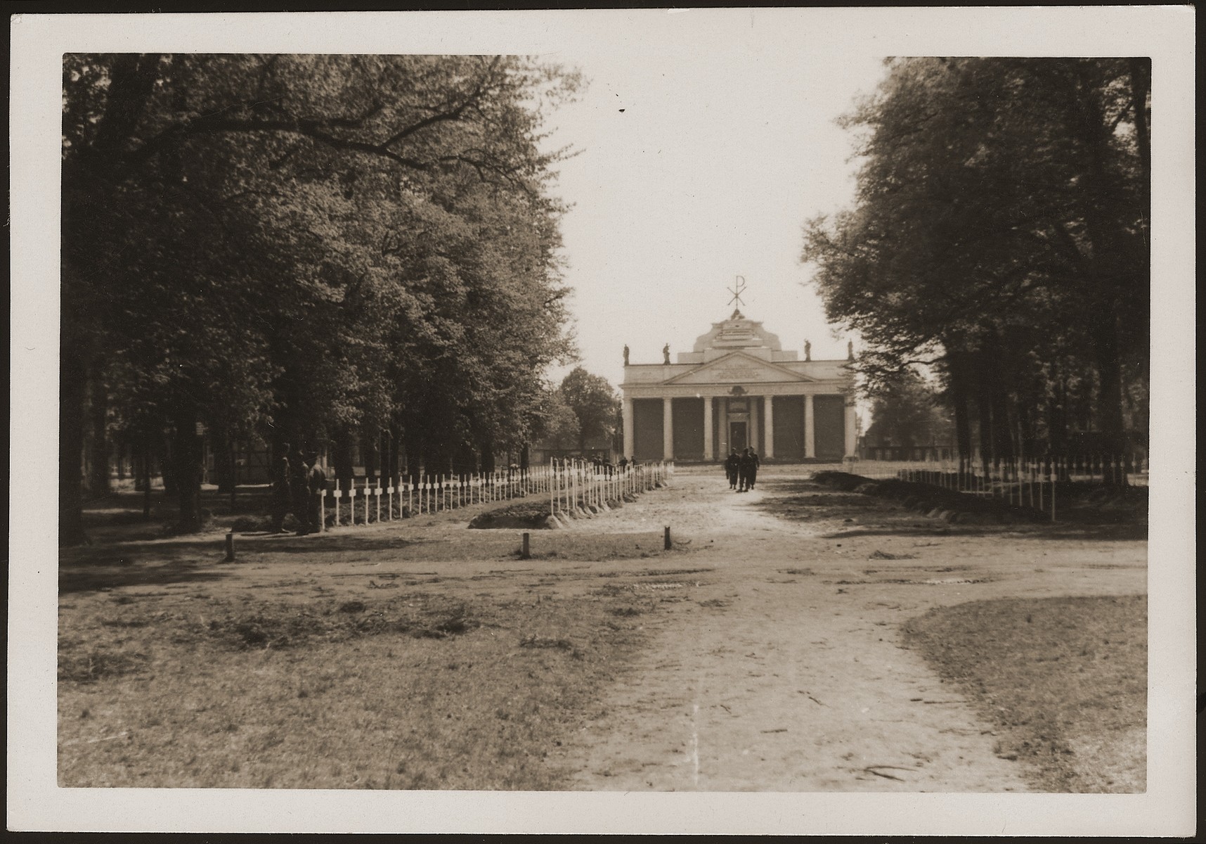 A view of the burial ground in Ludwigslust on the palace grounds of the Archduke of Mecklenburg, where the townspeople were forced by U.S. troops to bury the corpses of prisoners killed in the Woebbelin concentration camp .