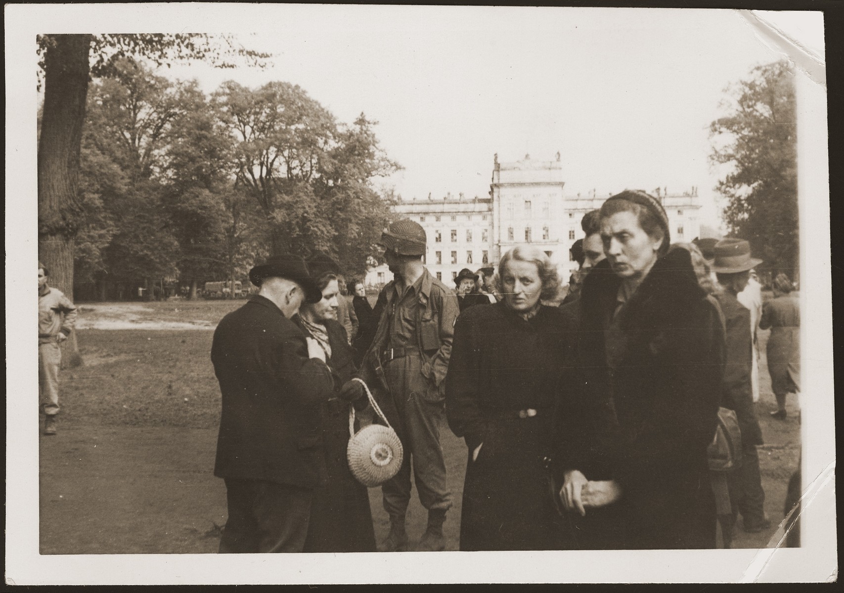 German civilians from Ludwigslust on the palace grounds of the Archduke of Mecklenburg, where they have been forced by U.S. troops to bury the bodies of prisoners killed in the Woebbelin concentration camp.