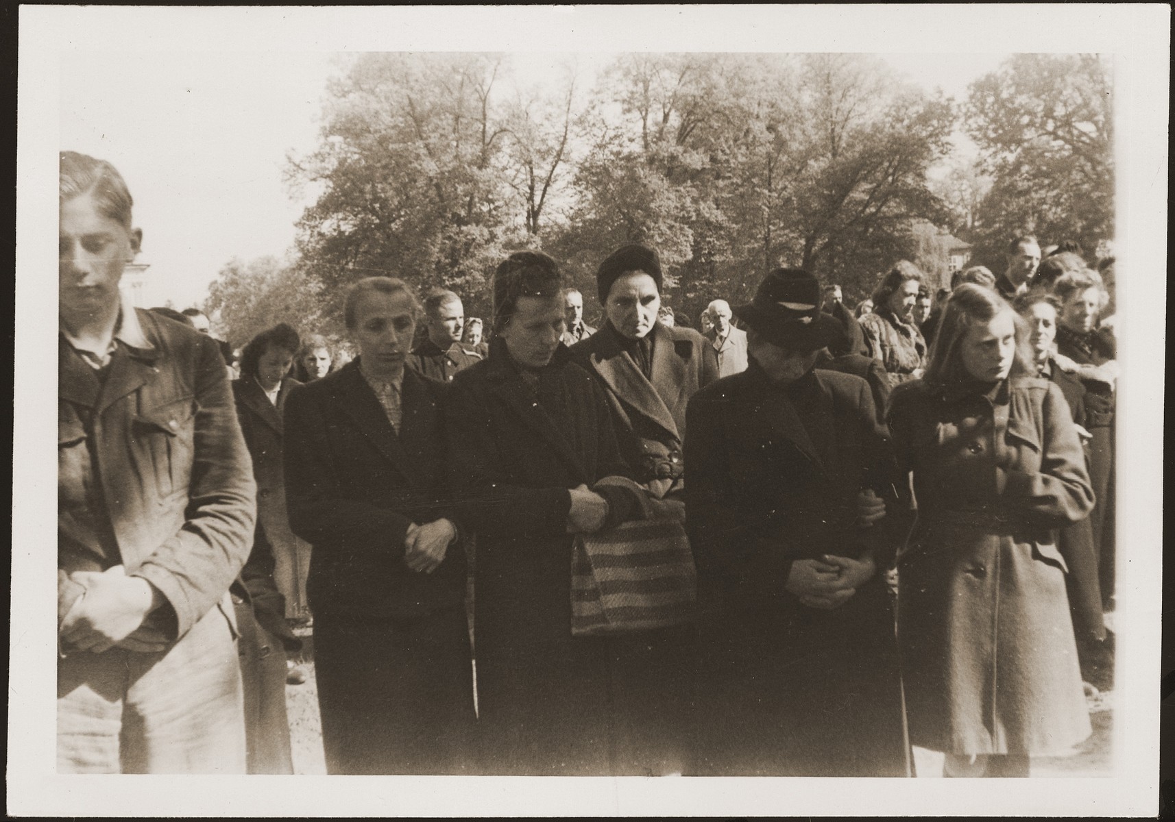 German civilians from Ludwigslust on the palace grounds of the Archduke of Mecklenburg, where they have been forced by U.S. troops to bury the bodies of prisoners killed in the Woebbelin concentration camp.