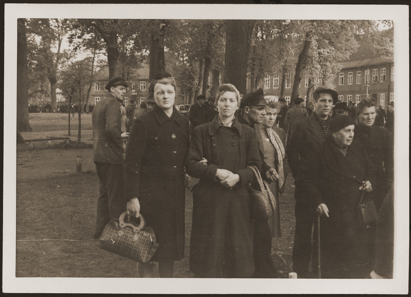 German civilians from Ludwigslust  on the palace grounds of the Archduke of Mecklenburg, where they have been forced by U.S. troops to bury the bodies of prisoners killed in the Woebbelin concentration camp.