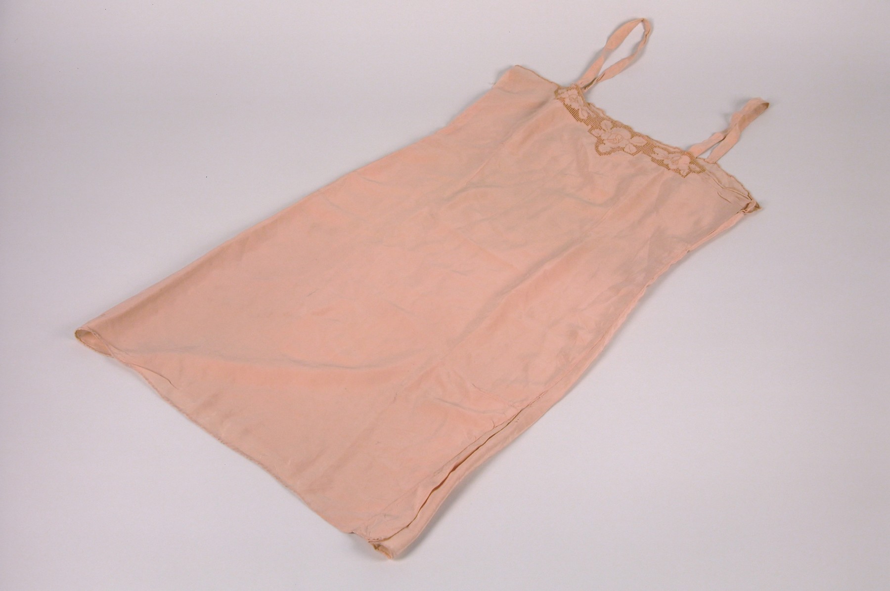 A chemise belonging to Anna Ilona Gondos, that was taken with her when she left Budapest on the Kasztner rescue train.  

The chemise was part of her trousseau when she married Bela Gondos in 1934.  Anna packed it along with several others on the Kasztner train to Bergen-Belsen.  It later accompanied her to Switzerland and, ultimately, to the U.S.