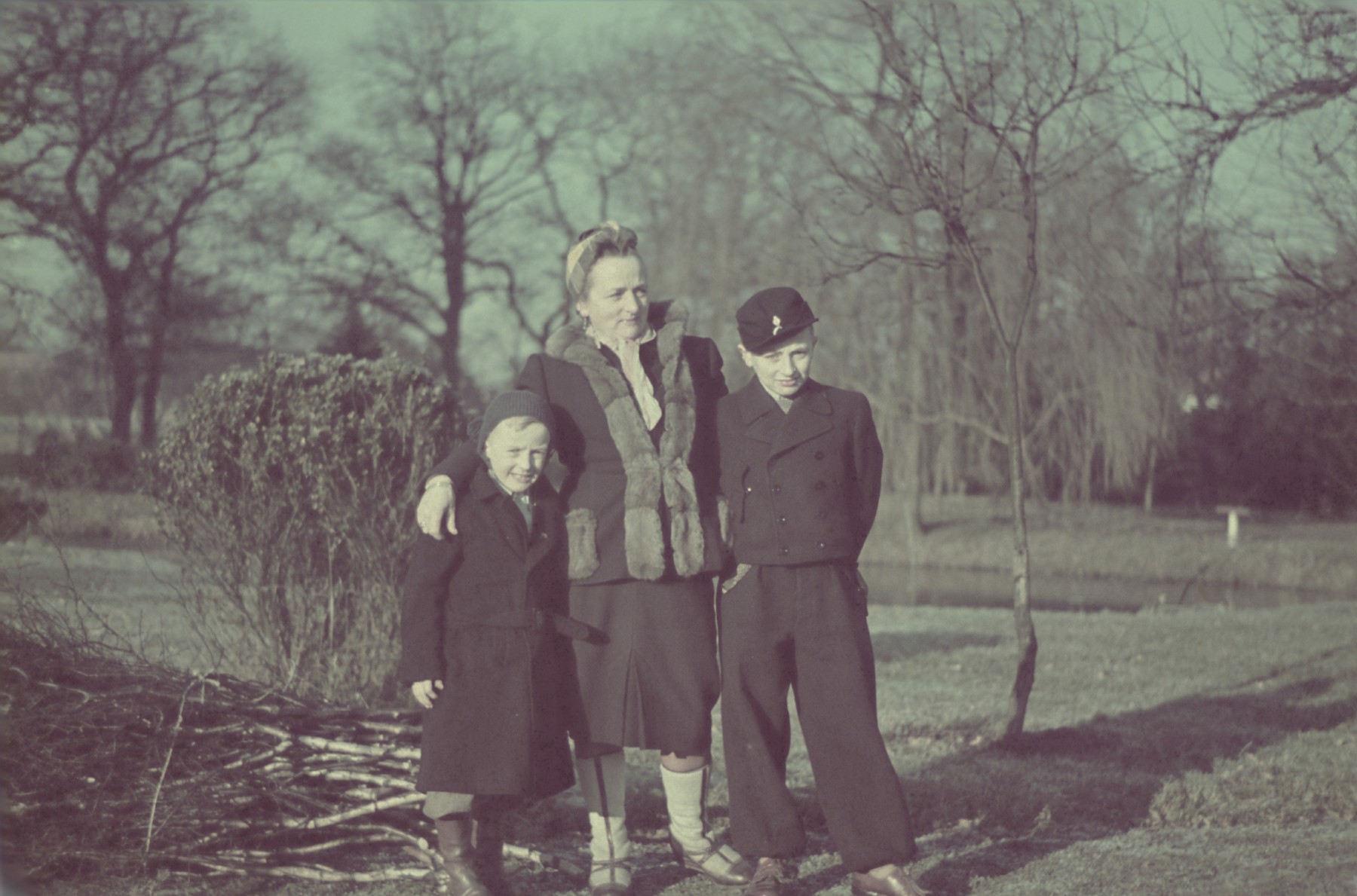 An unidentified woman stands with the two children of  Hans Biebow, Joachim and Werner, outside the Biebow home in Bremen.