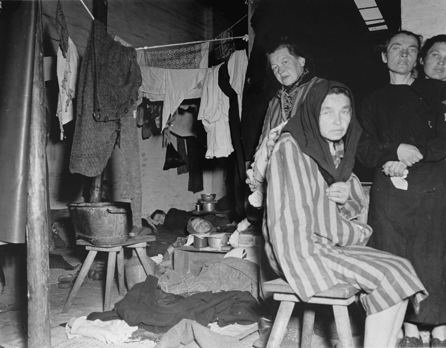 Female survivors inside a  barracks in Bergen-Belsen after liberation.

The original caption reads: "Interior of women's barracks in former Nazi prison camp at Belsen, Germany, showing pitiful conditions under which they were forced to live."
