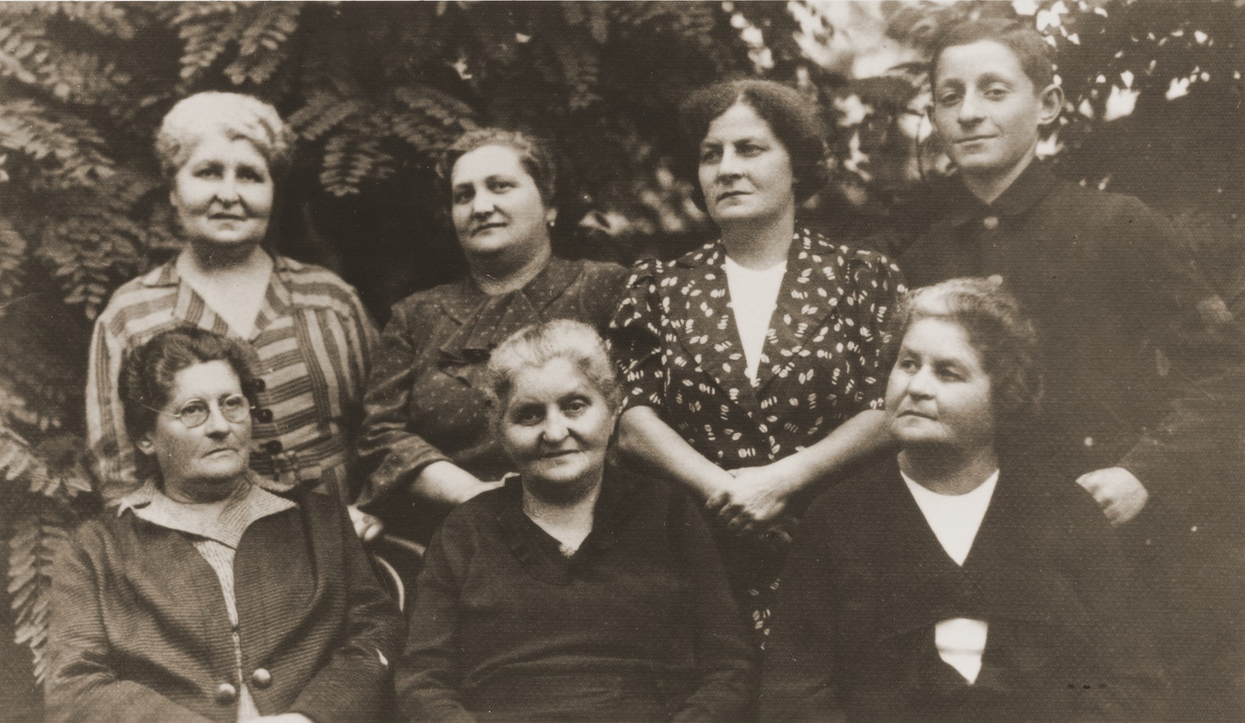 Emma Wurmbrand Hirsch with her four sisters, niece and nephew.  

Pictured standing from left to right are:  Berta Wurmbrand Vogel; Sidi Silberbusch Star; Shulamith Wurmbrand; and Yochanan Wurmbrand.  Seated from left to right are:  Emma Wurmbrand Hirsch; Pepi Wurmbrand Silberbusch; Lotti Wurmbrand Roth.