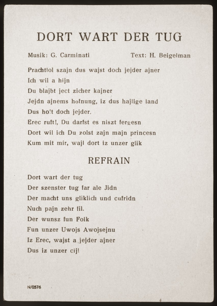 Song sheet for the Yiddish song "Dort Wart Der Tug" (There Awaits the Day) performed by The Happy Boys jazz band, which toured the displaced persons camps throughout Germany from 1945 to 1949. 

The music for this song was composed by G. Carminati, the lyrics, by Chaim (Henry) Baigelman.