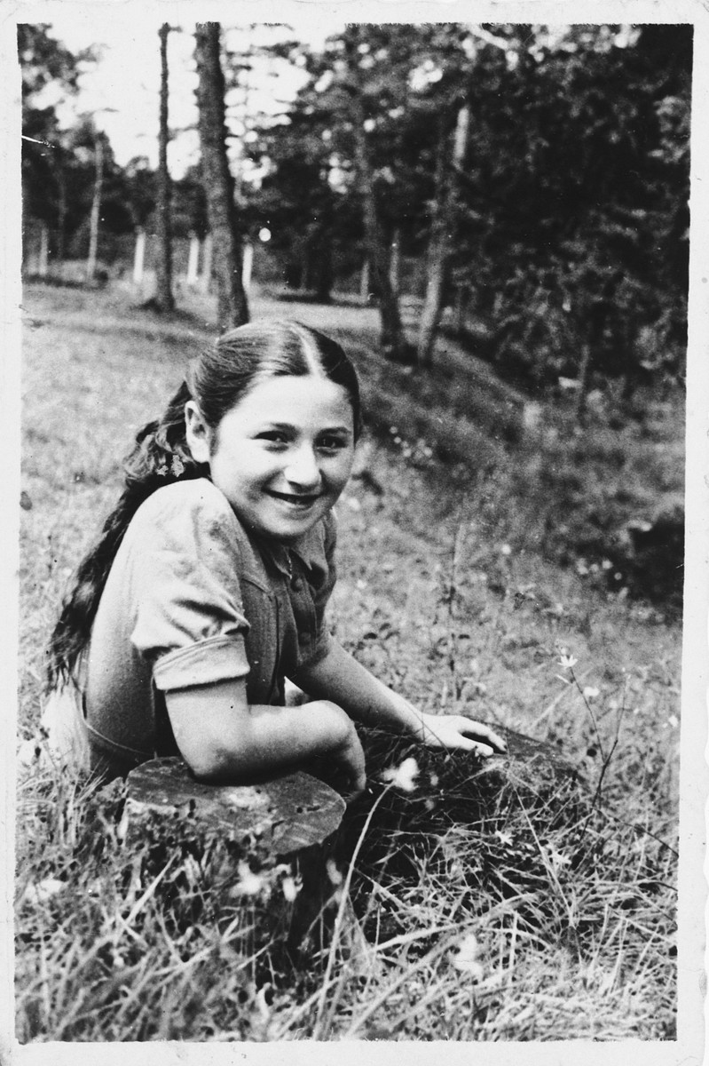 Sonia Dzienciolski  in a field of wildflowers.