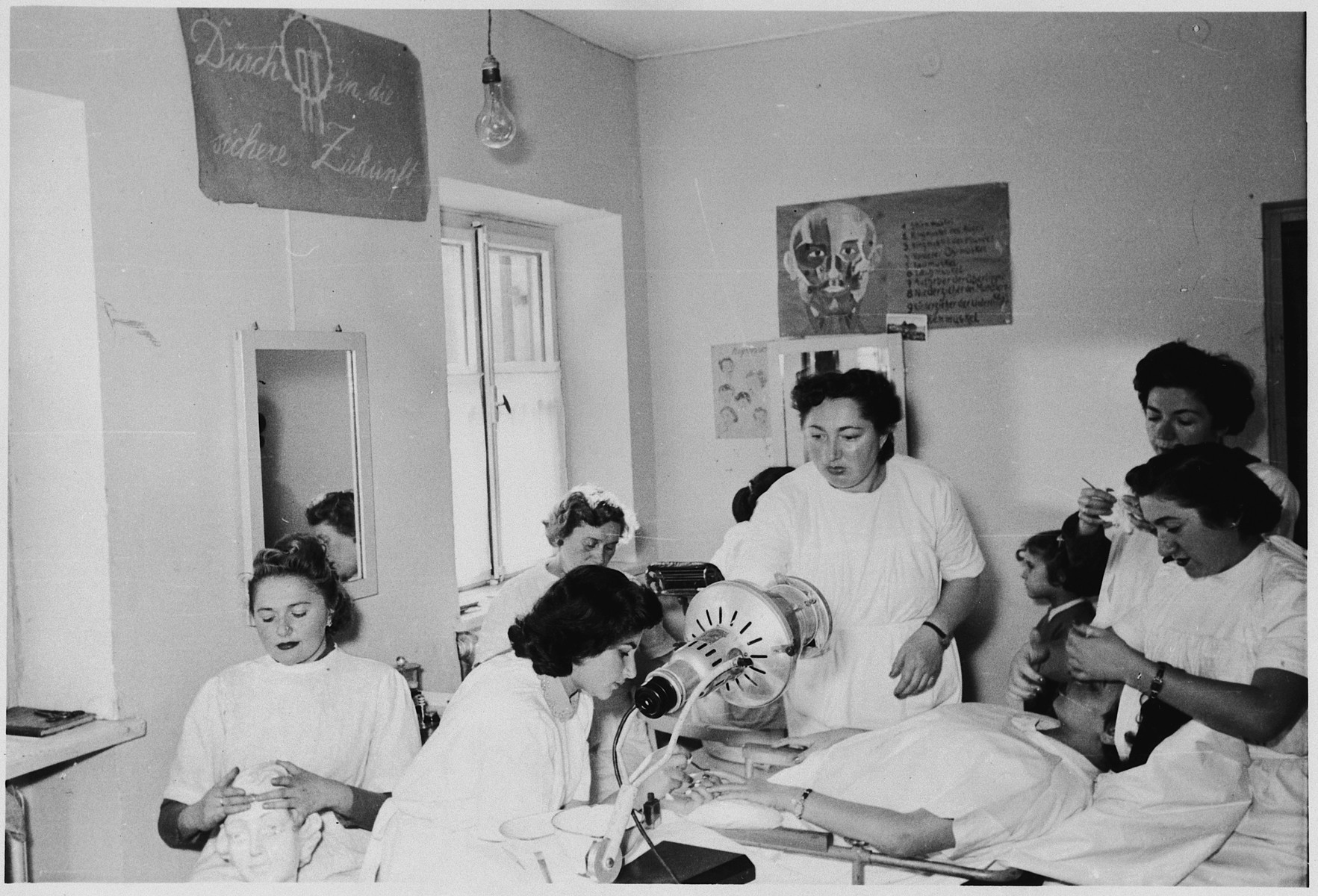 Women learn to become beauticians in an ORT school in the Foehrenwald displaced persons camp.