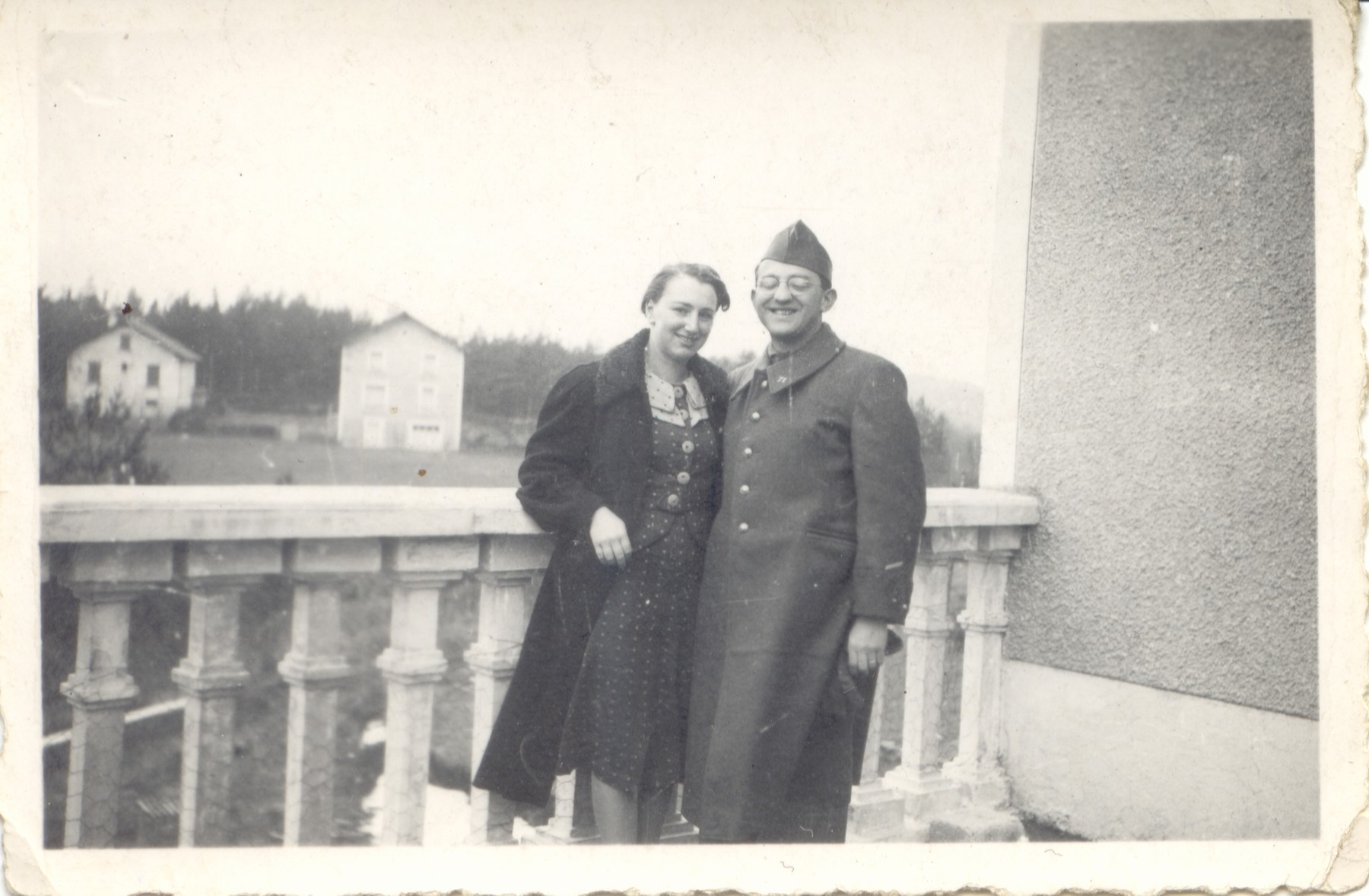 Rene and Germaine Brunschwig pose together on the balcony of a building in Le Chambon-sur-Lignon.