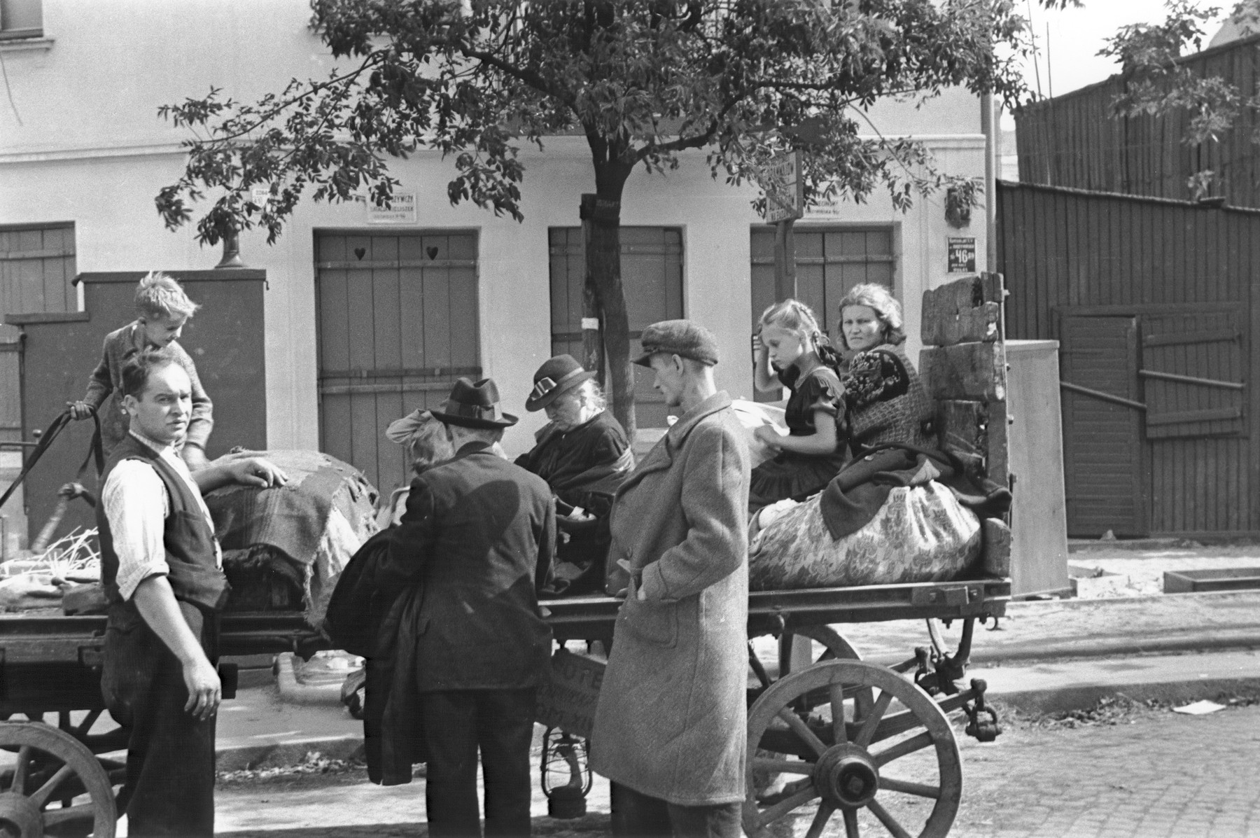 A family of Polish peasant refugees arrive in Warsaw on a horse-drawn wagon during the siege of the capital.