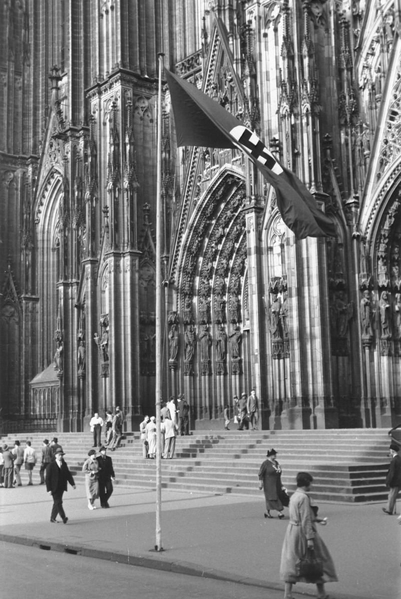A Nazi flag flies in front of the Cologne Cathedral.
